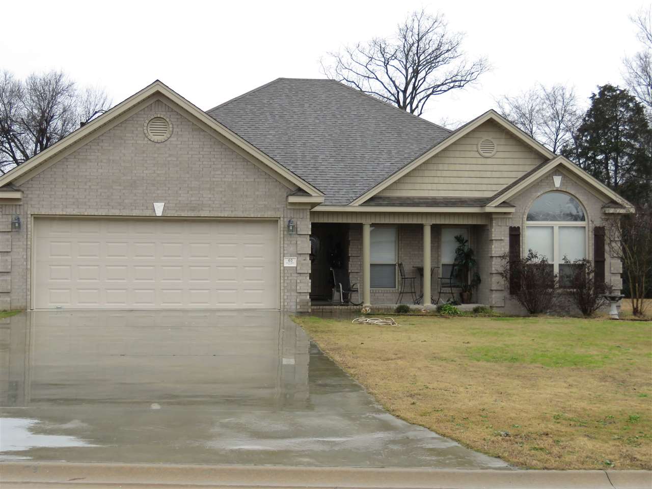 This home has great curb appeal which continues to the interiors.  Great room has pan ceiling laminate hardwood flooring and gas log fireplace.. Nice details and trim throughout the home..  Large master suite with sitting area.  Master bath has separate vanities with granite counter tops,  jetted tub and oversized walk in closet