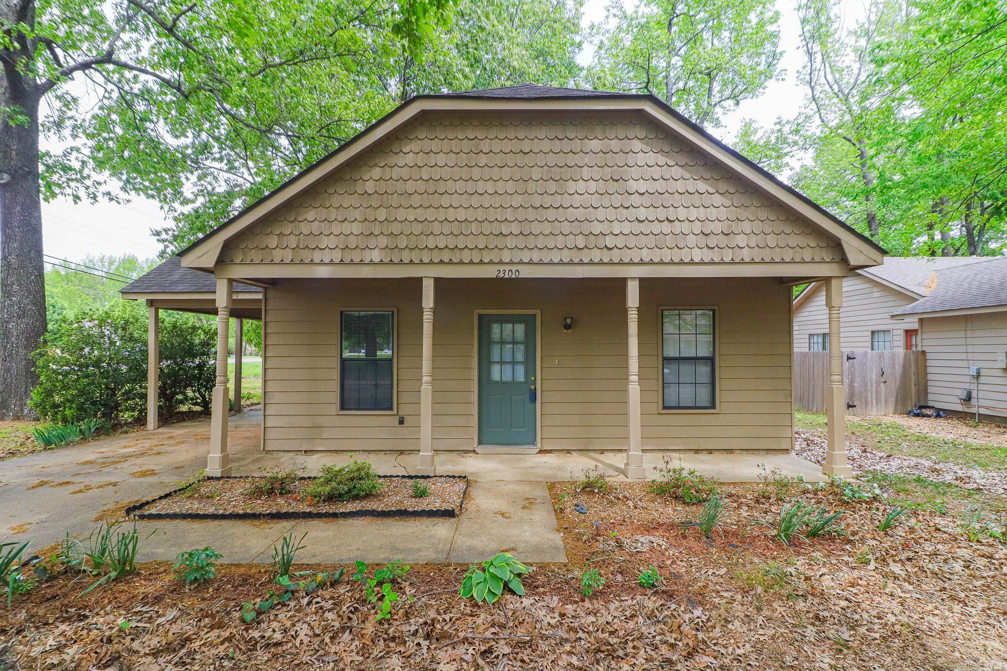 Welcome to 2300 Biltmore Cove in the desirable Fox Meadow Village subdivision in Jonesboro, Ar. This 3 bedroom, 2 bath home sits on a beautiful tree-shaded corner lot and offers comfort, convenience, and value in a prime location. Inside, you'll find central HVAC for year-round comfort and a cozy wood-burning fireplace that anchors the living space---perfect for relaxing evenings at home. The kitchen is well-equipped with a gas range and dishwasher, offering both functionality and efficiency for everyday living. Step outside to enjoy the concrete patio overlooking the backyard---ideal for grilling, entertaining, or simply enjoying the shade from mature trees. The large carport provides ample covered parking and additional storage options. Located just minutes from a local elementary school and some of Jonesboro's best shopping and dining options, this home combines neighborhood charm with everyday convenience. If you're searching for an affordable 3 bedroom home in Jonesboro, Ar. with a great lot and strong location, this one deserves a closer look.