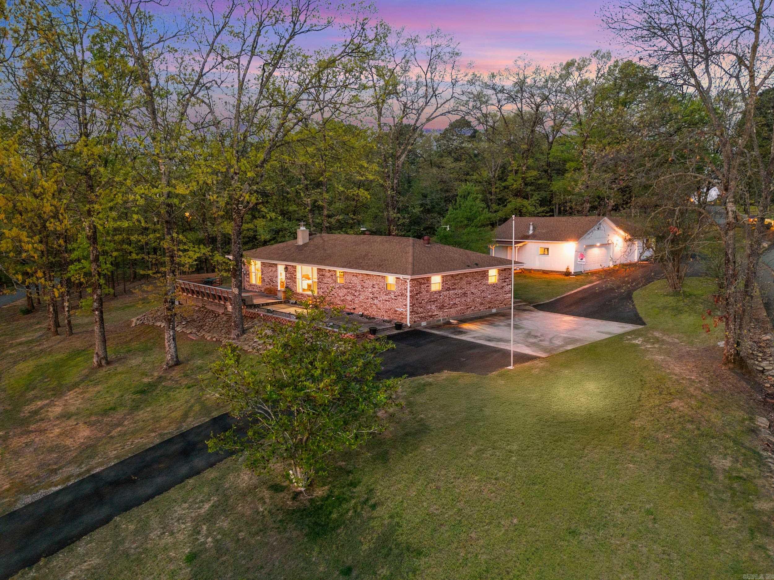 Wow truly a showstopper! Enjoy lake views of Greers Ferry Lake from this beautifully remodeled 3 bedroom, 2 bathroom home set on 1.28 acres. Designed with both comfort and functionality in mind, this home features updated finishes throughout and a layout that feels open, inviting, and easy to live in. The property also includes a detached three car shop, providing plenty of space for storage, projects, or additional parking. As a rare opportunity, this home is being sold fully furnished, making it truly turnkey and move in ready. Minutes from the Fairfield Bay Marina and Fairfield Bay community. With new appliances, windows, HVAC system, water heater, fireplace, flooring, paint, interior and exterior doors, electrical, and plumbing all completed in 2022, this home is truly offers peace of mind for years to come.