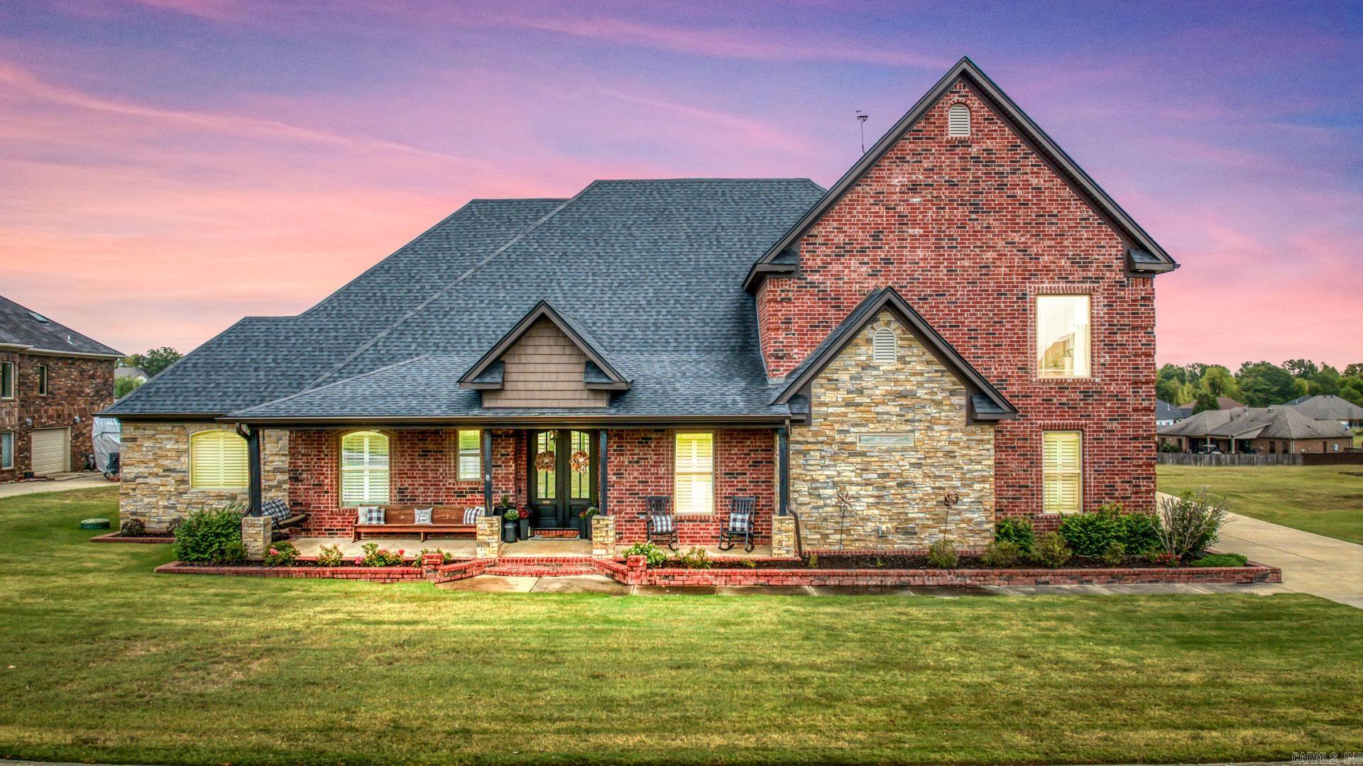 Experience luxury living with breathtaking Arkansas River views in this exceptional custom home! From the inviting front porch and impressive double front doors to the thoughtfully designed open floor plan, every detail has been carefully crafted. The chef’s kitchen features custom cabinetry, granite countertops, an oversized island, built-in double ovens, and a gas cooktop, all opening to the spacious living area with soaring ceilings, rich hardwood floors, a beautiful fireplace with custom built-ins, and abundant natural light. The main level offers four bedrooms, including a private primary suite, a dedicated office, and an oversized laundry room. Upstairs, you’ll find a versatile bonus room with spectacular river views. Enjoy year-round entertaining on the expansive covered patio, plus the convenience of a 3-car side-entry garage. This home truly offers the perfect blend of elegance, comfort, and functionality.