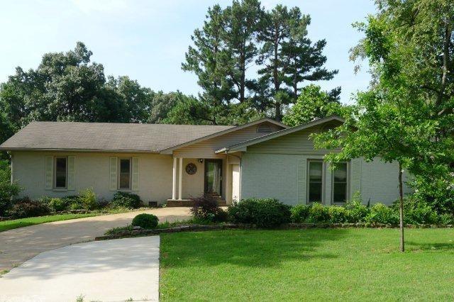 Home features 3 bedrooms with double closets, 2 baths and office.  Living room has wood burning fireplace with shelving, kitchen has updated countertops, lots of prep space and large pantry.  Nice carpet, hardwood and tile, walk-out basement-great for play, storage, or storm room.  Large lot has deck, wood privacy fence, nice landscaping and a large, very nice 20 x 20 workshop with two rooms.