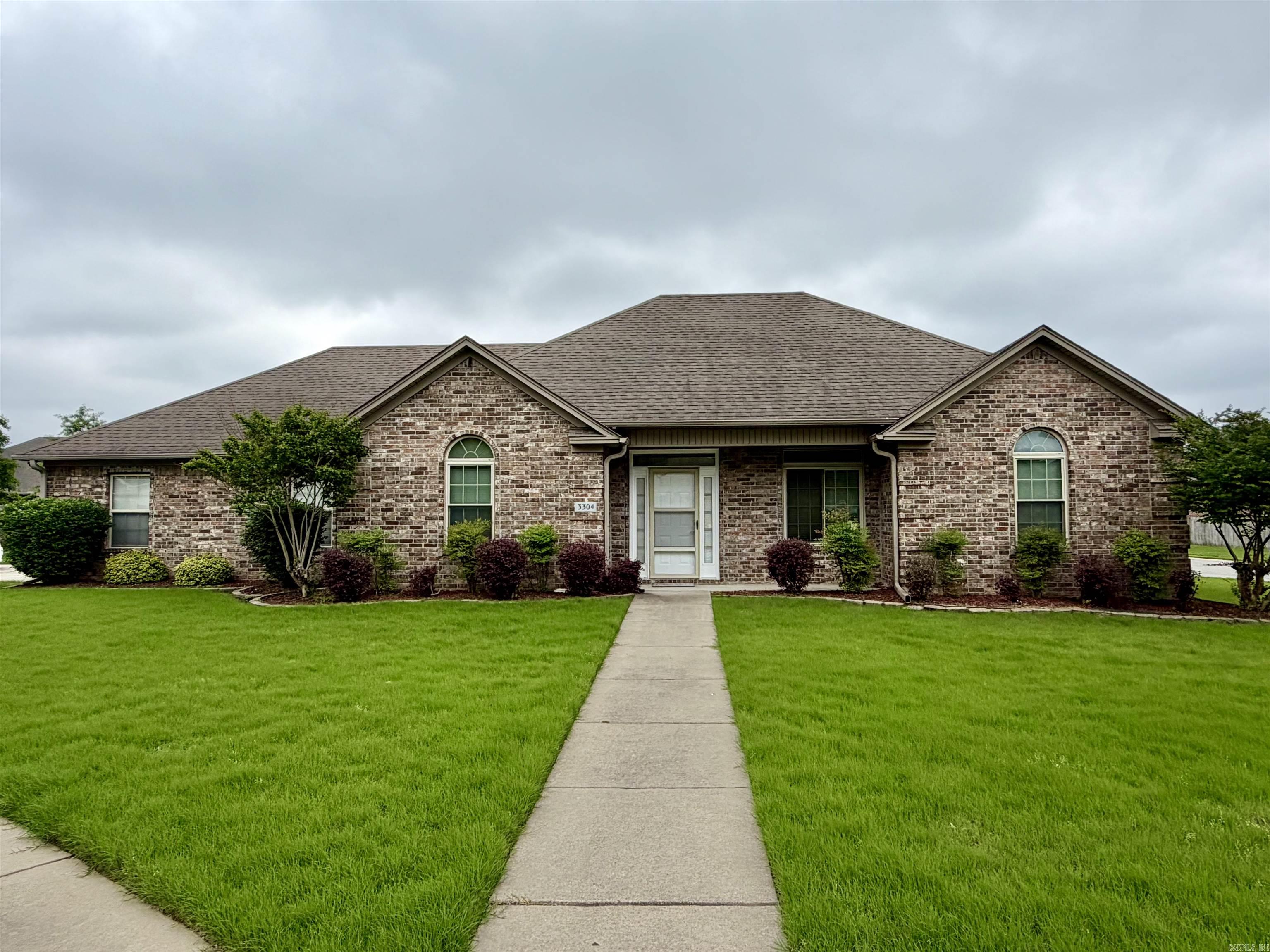 You know that feeling when a house just feels like home the moment you pull up? This is it. Located in one of Bryant’s most sought-after neighborhoods, this 3 bed, 2 bath brick home sits on a spacious corner lot with a side-entry garage and easy interstate access.  The standout feature is the added sunroom with custom shades just off the back patio—perfect for morning coffee, relaxing evenings, or hosting friends. It’s the kind of extra space buyers are always hoping to find.  Inside, the home feels fresh and move-in ready with full interior paint completed in May 2026, including walls, ceilings, trim, garage, and cabinets—now clean, refreshed and modern. The kitchen offers custom pull-out drawers, with an added bonus: refrigerator, washer, and dryer all convey.  Enjoy a cozy living area with gas fireplace and starter logs. Major updates include triple pane windows (2018) with lifetime warranty, HVAC (8 yrs, gas heat/electric air), and new hot water heater May 2026.  Homes like this-move in ready, well cared for, and in a prime location-don't last long. Come see what makes this one feel like home before it's gone.