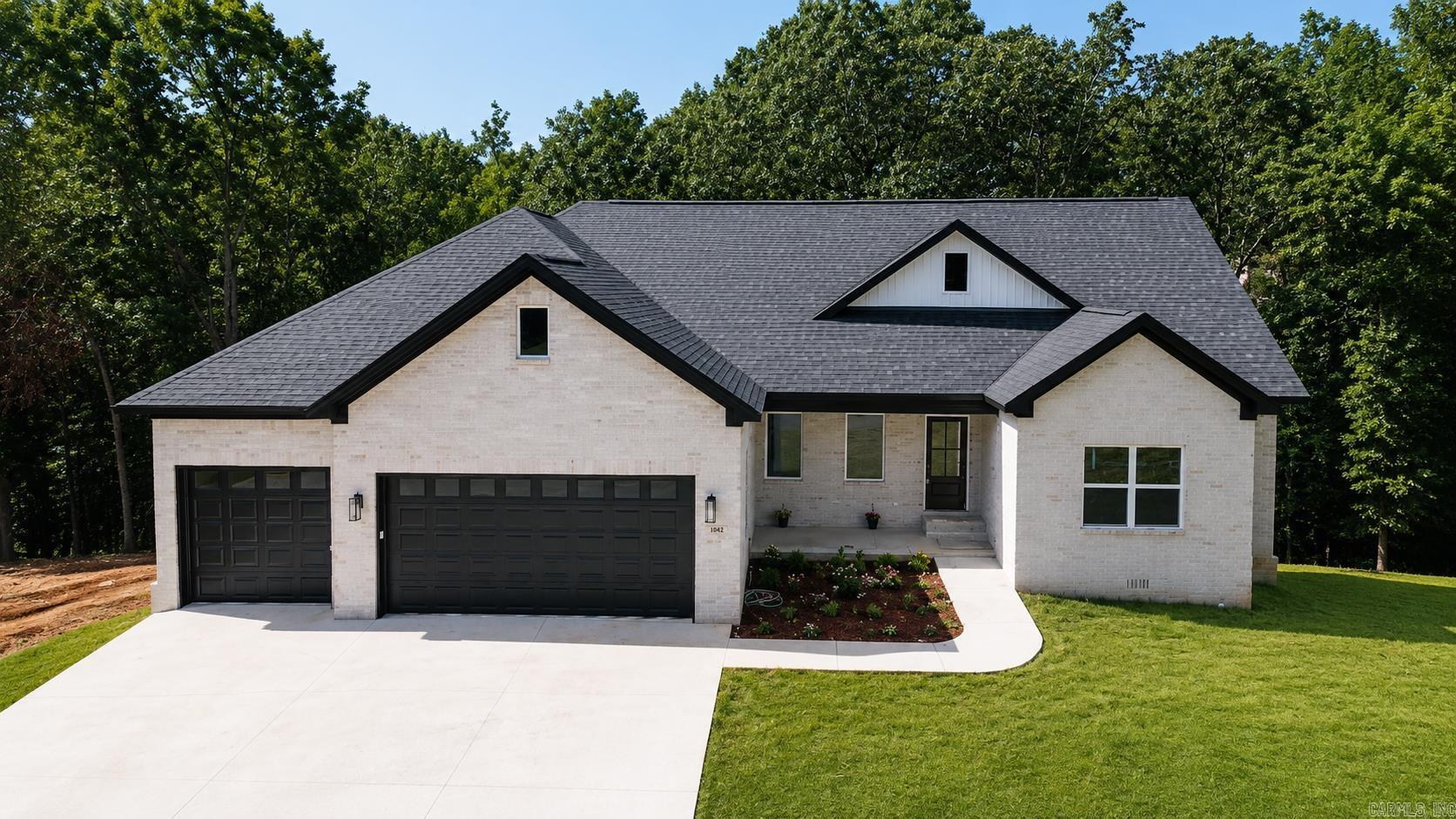 Brand new modern designed home. House Features Vaulted kitchen and Living Room ceilings. 4 spacious bedrooms. Large walk in pantry. 3 Car Garage and a Second Story deck over looking the backyard. Hardwood Floors through out entire Home with Tile in Bathrooms