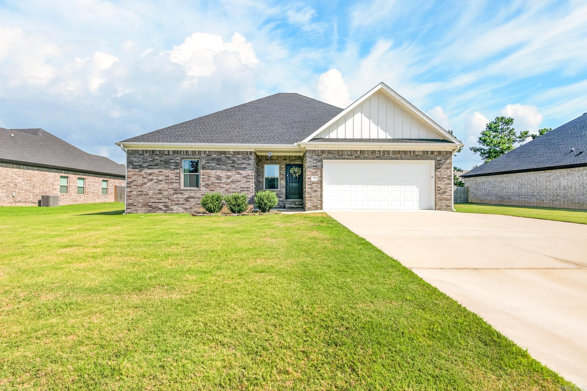 Beautiful all brick home features a spacious & modern design with 3 bedrooms and 2 bathrooms.  Step inside to an open floor plan that seamlessly connects the living room, dining area and kitchen.  The living room has a soaring vaulted ceiling and pretty beams across it for a coffered look.  The kitchen has gorgeous countertops, stainless appliances, ample cabinet space, a pantry and an island!  The master bedroom is HUGE with a walk-in closet and a bathroom that features a tub, tiled shower and dual sinks.  The other 2 bedrooms are generously sized as well.  Large covered patio overlooks the fenced backyard.  Garage is oversized - 22x23....perfect for larger vehicles and an extra parking pad.