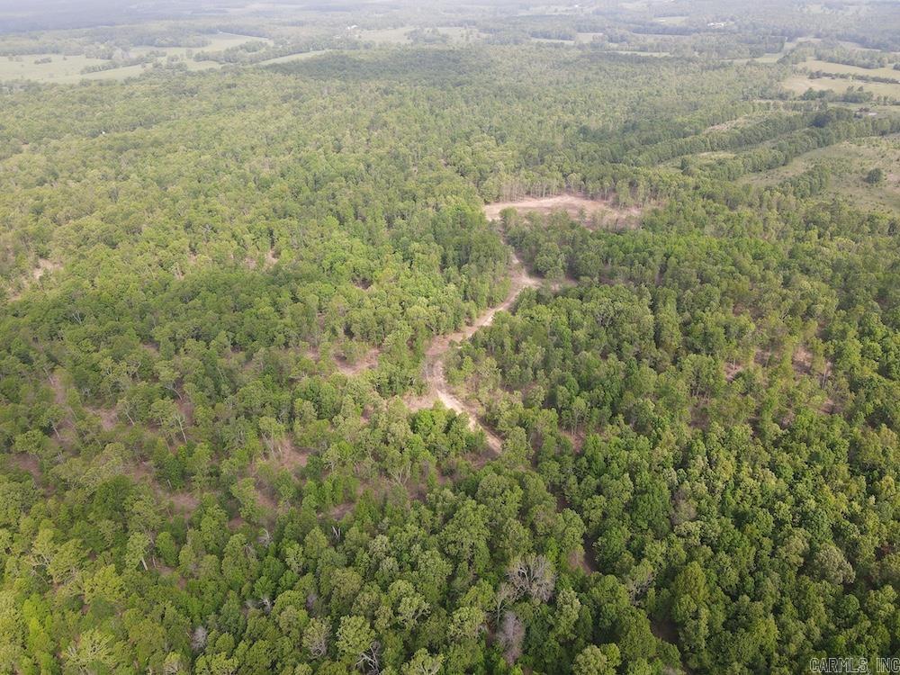 Exceptional 1,107± acre unrestricted Ozark tract spanning Howell County, Missouri and Fulton County, Arkansas, near Salem, Viola, and West Plains. This large contiguous property offers outstanding whitetail and turkey hunting, rolling hardwood ridges, draws, pinch points, and excellent access from a gravel county road with Highway JJ frontage. A recent select timber harvest created ideal wildlife habitat with thick regeneration, red oak stands, native grasses, brushy cover, and open pockets perfect for food plots or pasture. Miles of interior trails provide easy access throughout the property for hunting, scouting, and recreation. Deer sign is abundant, with strong turkey populations across the diverse terrain. A large old field, cedar thickets, spring-fed pond, and scenic natural spring surrounded by rock outcroppings and sycamore trees add beauty and year-round water sources. With no restrictions, the possibilities are endless—build cabins, homesites, hunting camps, or run livestock while enjoying a premier recreational and investment property in the Ozarks.