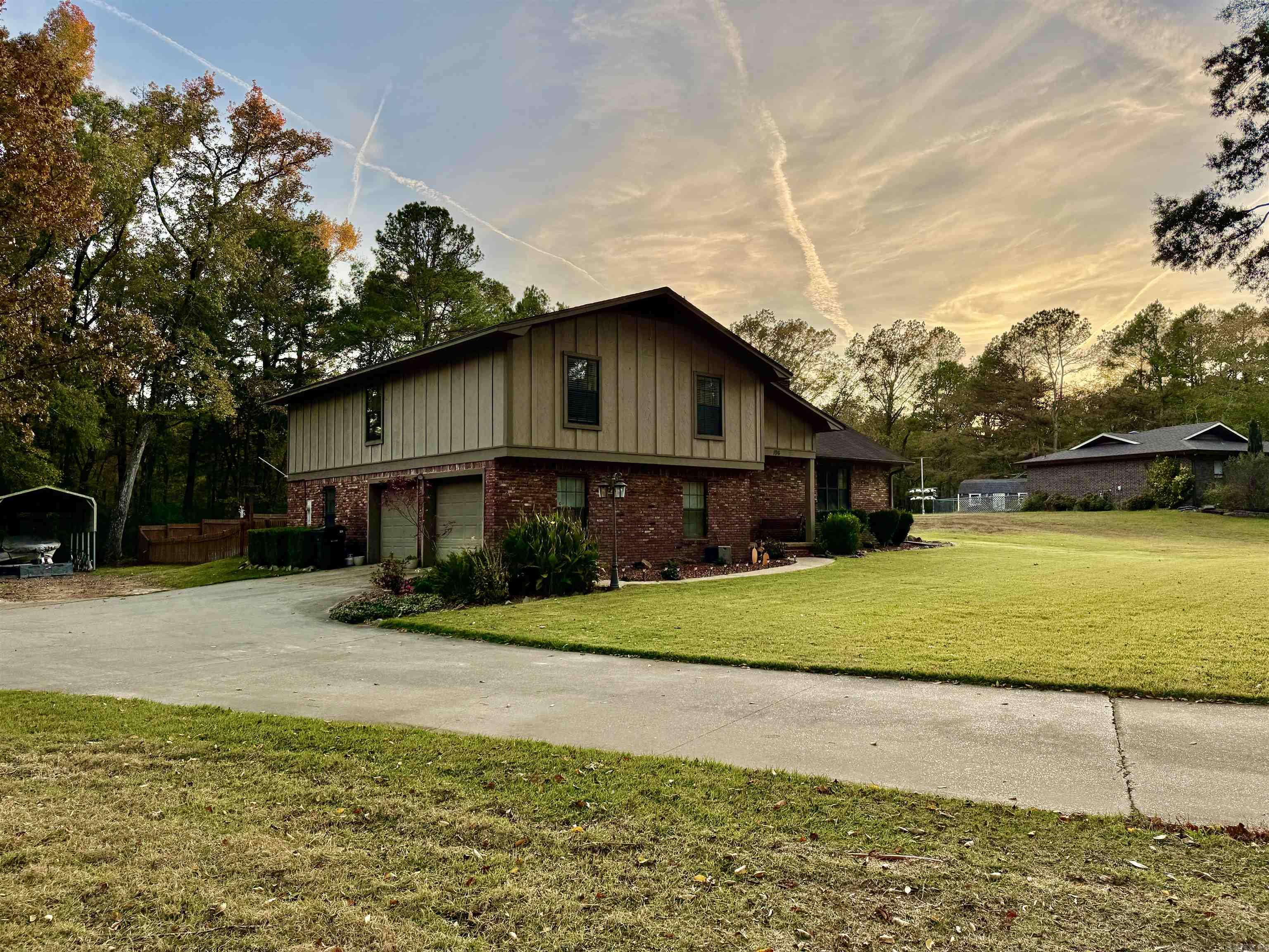This beautiful 4-bedroom 2.5-bath home in the Lake Hamilton School District has too many extras to mention.  It sits on an acre of land and comes with a dream pool and 20x25 shop!  You'll fall in love with the updated kitchen and hardwood floors. While the house has municipal water, there is a well for the lawn irrigation system. Being almost to the end of a cul-de-sac road, there is very little traffic in this quiet and peaceful neighborhood. Location also qualifies for Rural Development. The kitchen has an electric range but is plumbed for gas.  The outdoor area is plumbed for a natural gas grill.