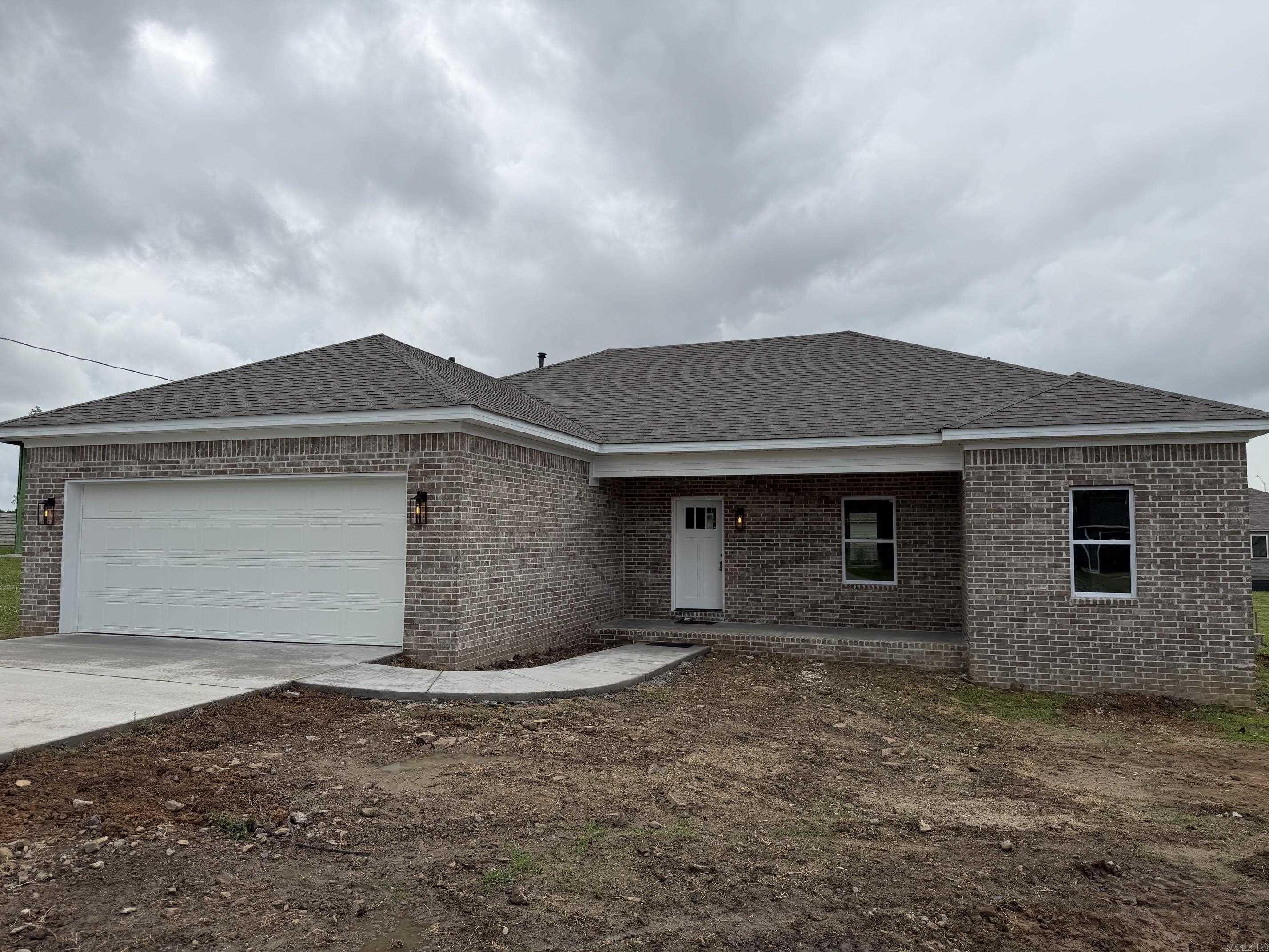 Affordable new custom home in a quiet neighborhood! This 3-bedroom, 2-bathroom home features an open living/dining floor plan with luxury vinyl plank floors and 9' ceilings. The kitchen includes a quartz breakfast bar, a deep sink, and modern appliances. The master bedroom is spacious, and the master bath offers a separate walk-in shower with a seat and a walk-in closet. A large laundry room adjoins the oversized two-car garage. A one-year builder's warranty is included.