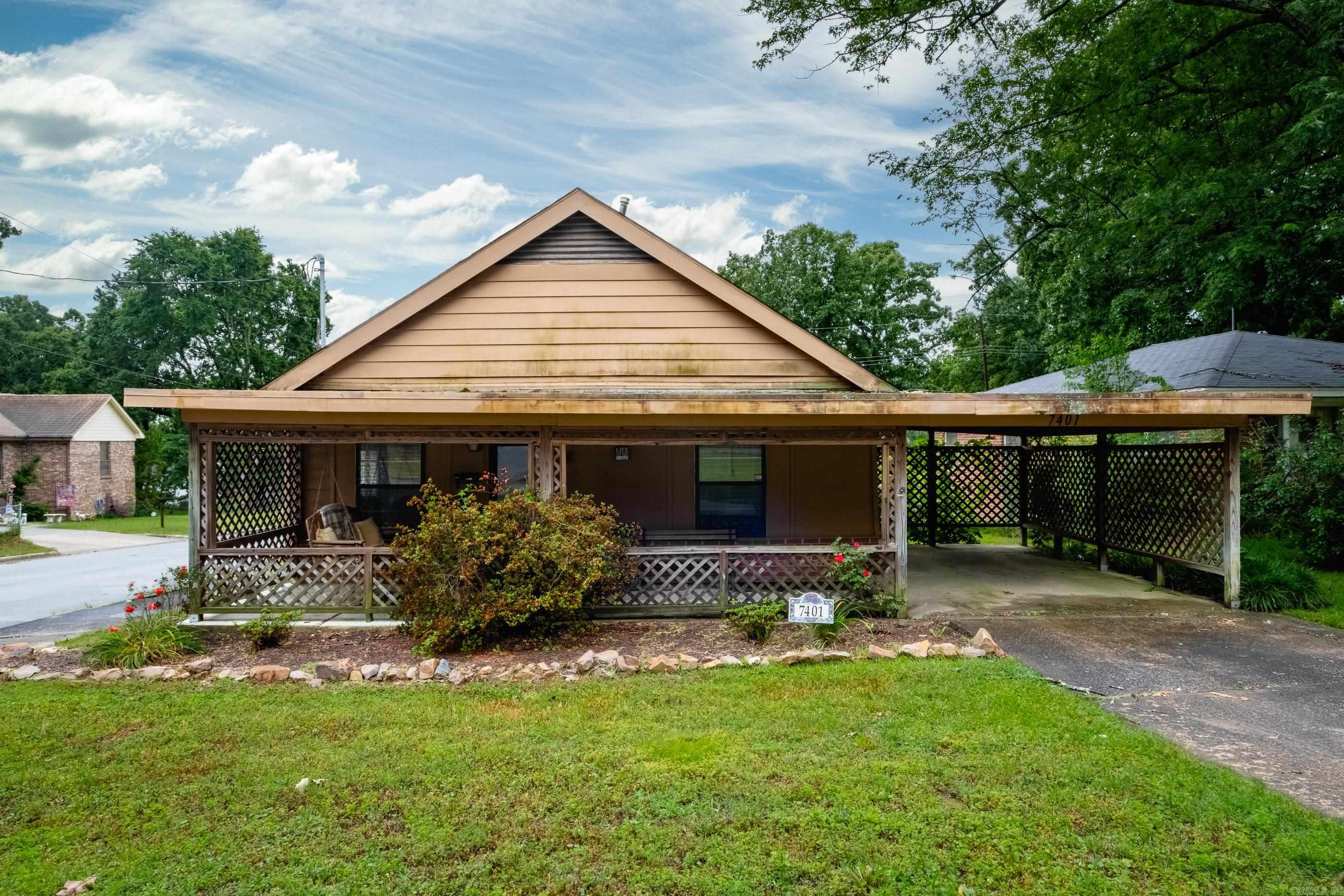 Enjoy the comfort of a Midtown home—an ideal alternative to apartment living for a single buyer or a family of three. Situated on a corner lot, this inviting property features a fenced backyard, covered back deck, and a spacious covered front porch. Hardwood floors run through the main living areas, with tile in the wet areas.