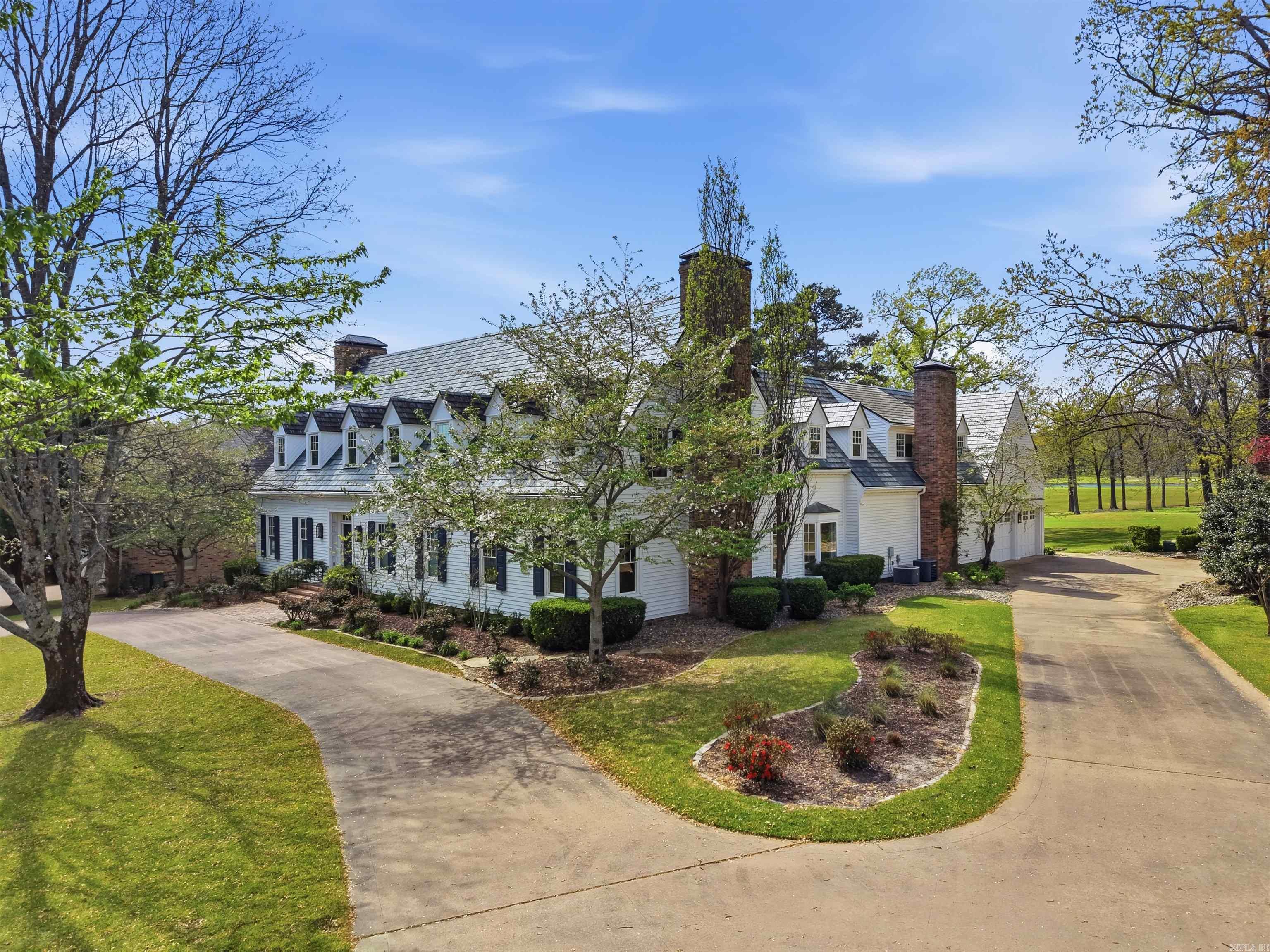 A stately colonial residence overlooking the 2nd tee of Pleasant Valley Golf Course. Originally built in 1986 and expanded & extensively renovated, this home blends timeless design, refined updates, & a gracious floor plan designed for both entertaining & everyday living, all enhanced by golf course views. A gracious foyer sets the tone with 9ft ceilings adjacent to the formal dining room and den with fireplace. The gourmet kitchen is beautifully appointed with Carrara marble countertops and backsplash, stainless appliances, a breakfast room & a spacious pantry. A handsome office features oak wood panel holding and a fireplace. An incredible den overlooks the pool with a fireplace, wet bar and full bathroom convenient to the pool. Upstairs, the primary suite offers a sitting area, beautiful natural light and a spa-like bathroom. Two guest bedrooms share a fully renovated Jack-and-Jill bathroom. Two additional bedrooms offer en-suite bathrooms which were also fully renovated. The backyard features a stunning gunite pool with flagstone patio creating a private retreat incredible golf course views of the Pleasant Valley Golf Course.