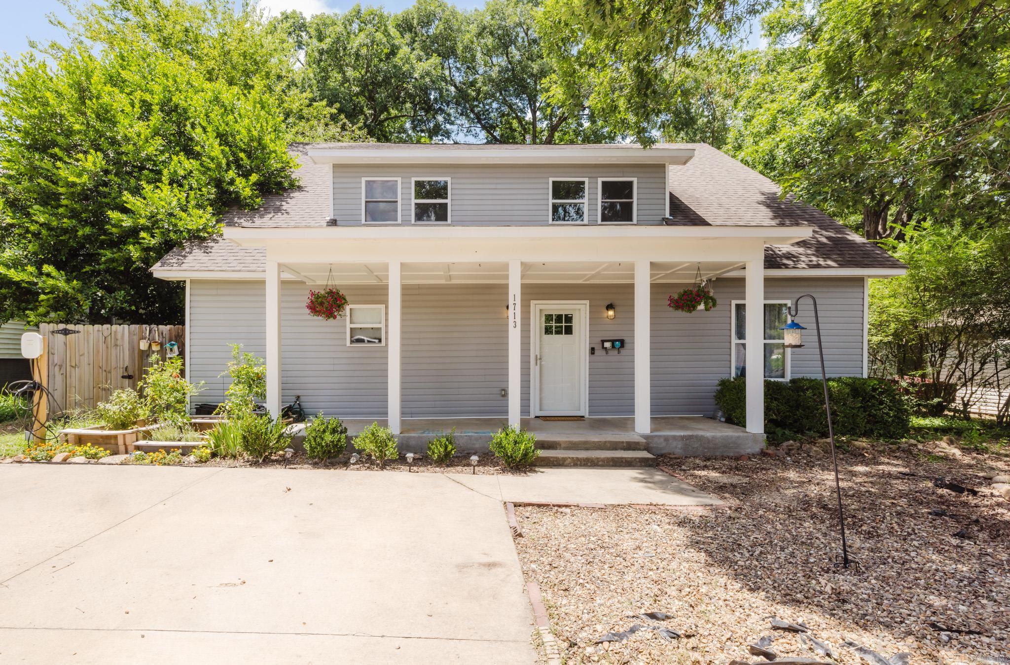 A Riverdale gem with space for you and the people you love. This two-story traditional features a level 2 EV car charger, multi-section garden bed framing, a screened in back porch, a storm cellar, brand new kitchen appliances, and way more. The front door opens up to a spacious open concept dining/ living area with a gorgeously designed gallery kitchen to the left. An oversized copper sink, butcher block shelving, new dark teal moody paint, bronze stylized hardware, and brand new appliances with fridge included make the kitchen a focal point of the home. The primary bedroom and bathroom are on the first floor, along with a half bath. Upstairs you will find three more bedrooms and a dedicated laundry room, washer and dryer included. Two of the bedrooms are connected by a jack-and-jill style full bathroom. Back downstairs through the back door is a large screened in back porch, perfect for enjoying the outdoors without worrying about mosquitoes. This area would also make a fabulous catio! The fully fenced in backyard is made complete with both a storm cellar and a separate storage building. Great neighborhood and walking distance to some of the best restaurants in Little Rock.