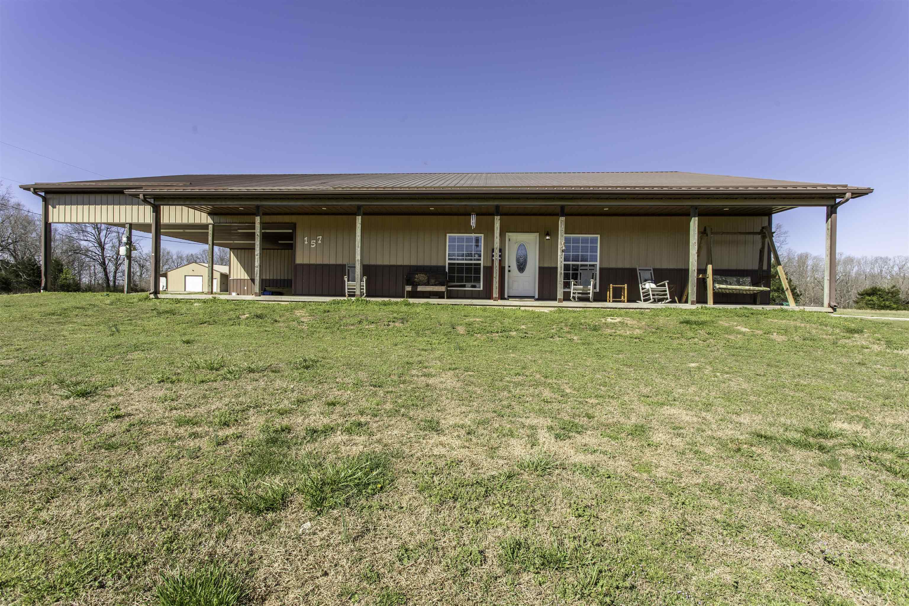 3 separate living spaces | Approx. 4,600 total sq ft at about $121/sq ft | Priced $60,000 below recent appraisal | 13.59 acres m/l with infrastructure that may offer future development potential! Instant equity! Priced $60k BELOW recent appraisal. Exceptional opportunity for home buyers, investors or developers.  Rare multi-home estate on 13.59 acres m/l in Sharp County, AR  just outside Highland city limits. This versatile property features 3 sep living spaces totaling approx. 4,600 sf—perfect for a family compound, multi-generational living, or rental income. The MAIN home is a custom-built all-electric barndominium (2016) offering approx. 2,500 sq ft on one level with 4 beds, 2.5 ba, spacious kitchen, oversized pantry, bonus room, and stained concrete floors. Energy-efficient with spray foam insulation and new HVAC (4/26). A 1,500 sf recently renovated GUEST house includes 3 bed 2 ba, and central HVAC—ideal for extended family or tenants. The 30x50 shop features central heat/air plus a 600 sf partially finished STUDIO with ba. Mostly level, usable land includes several lots with city water/sewer for possible additional home sites. Playground, private setting just off pavement.