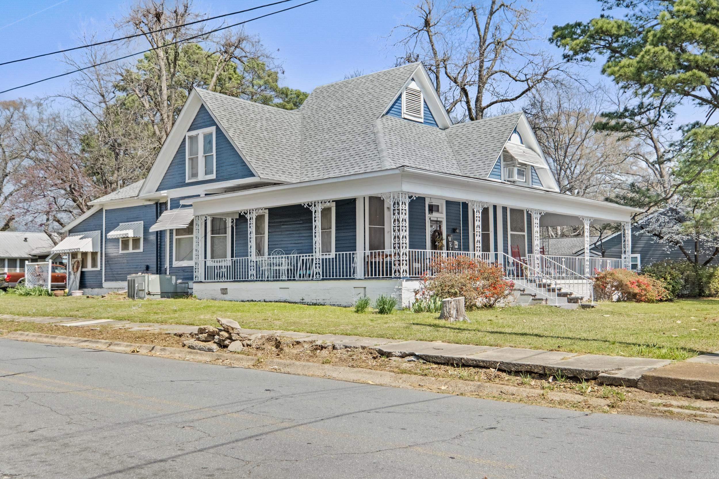 Step into timeless Southern charm with this stunning 1910-built Victorian, gracefully positioned on a sprawling corner lot in the heart of Searcy. With over 3,100 square feet, this 6-bedroom, 2-bath home offers the perfect blend of character, scale, and opportunity. From the moment you arrive, the wraparound porch invites slow mornings and golden-hour evenings, while inside, original architectural details and two fireplaces create a warm, story filled atmosphere you simply can’t replicate. Whether you’re dreaming of a spacious personal residence, a multi-generational home, or envisioning a boutique bed & breakfast, this property delivers unmatched versatility and presence. Homes like this don’t just exist, they’re experienced. Call for your private showing! AGENT REMARKS