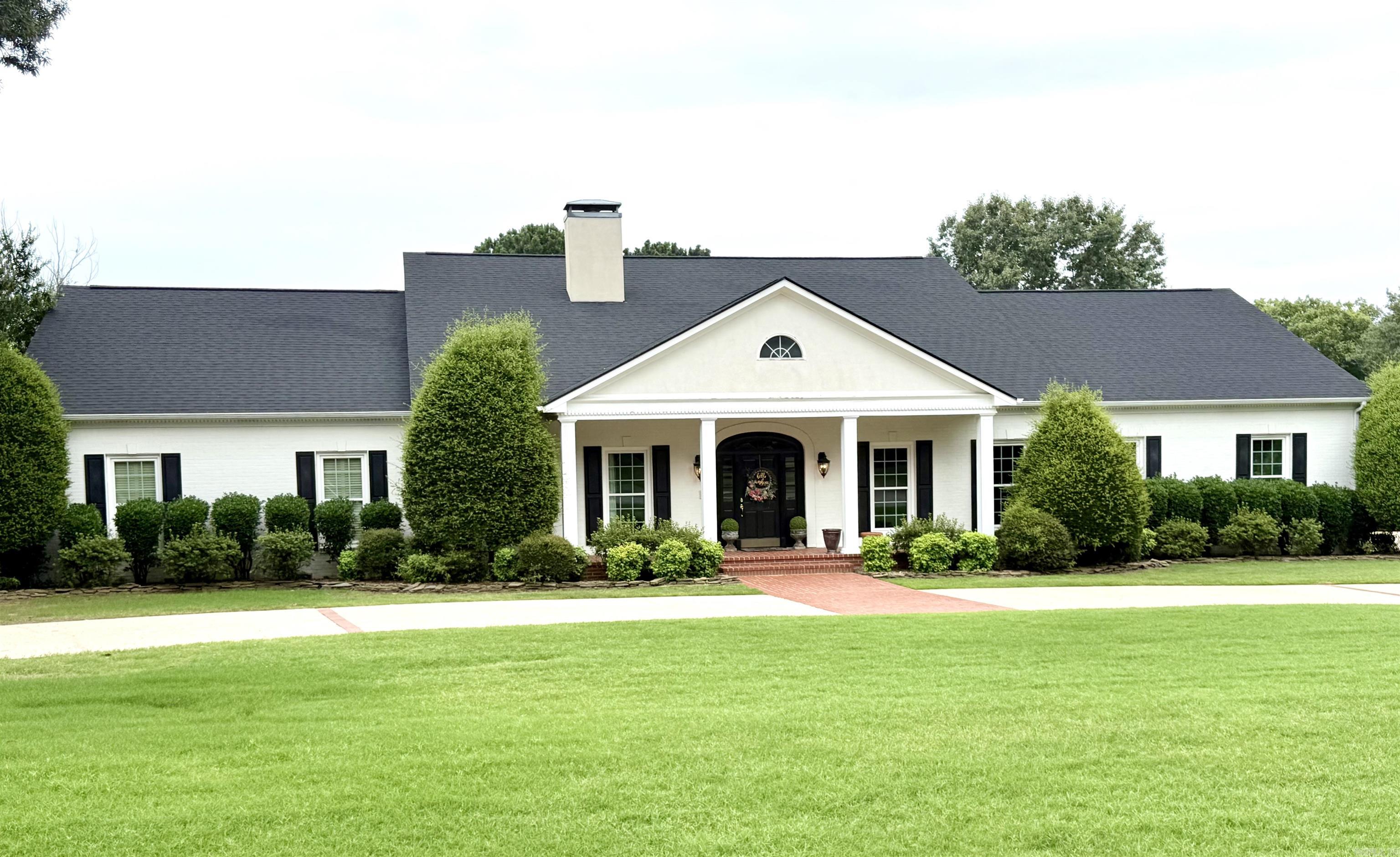 Nestled on a beautifully landscaped 1.16-acre corner lot in the highly desirable Searcy Country Club area, this timeless home offers the perfect blend of classic charm, spacious living and modern convenience. Featuring 4 BR and 4.5 BA, this exceptional property is thoughtfully designed for both comfortable everyday living and entertaining. Guests are welcomed in the foyer, highlighted by beautiful hardwood flooring, which continues into the formal dining room and throughout the spacious open living, kitchen and dining area which provides the perfect setting with large windows that overlook the pool area. The large primary suite serves as a private retreat, offering generous space and comfort. Each of the 3 bedrooms have their own bath, with two of them being on the second floor. Upstairs, you will also find a huge game room and a bonus area as well. Custom closets throughout the home and abundant storage spaces ensure everything has its place. Step outside to your own backyard oasis featuring an inground saltwater swimming pool, ideal for relaxing and enjoying Arkansas summers. Additional highlights include a two-car garage plus golf cart. Agents, see remarks!