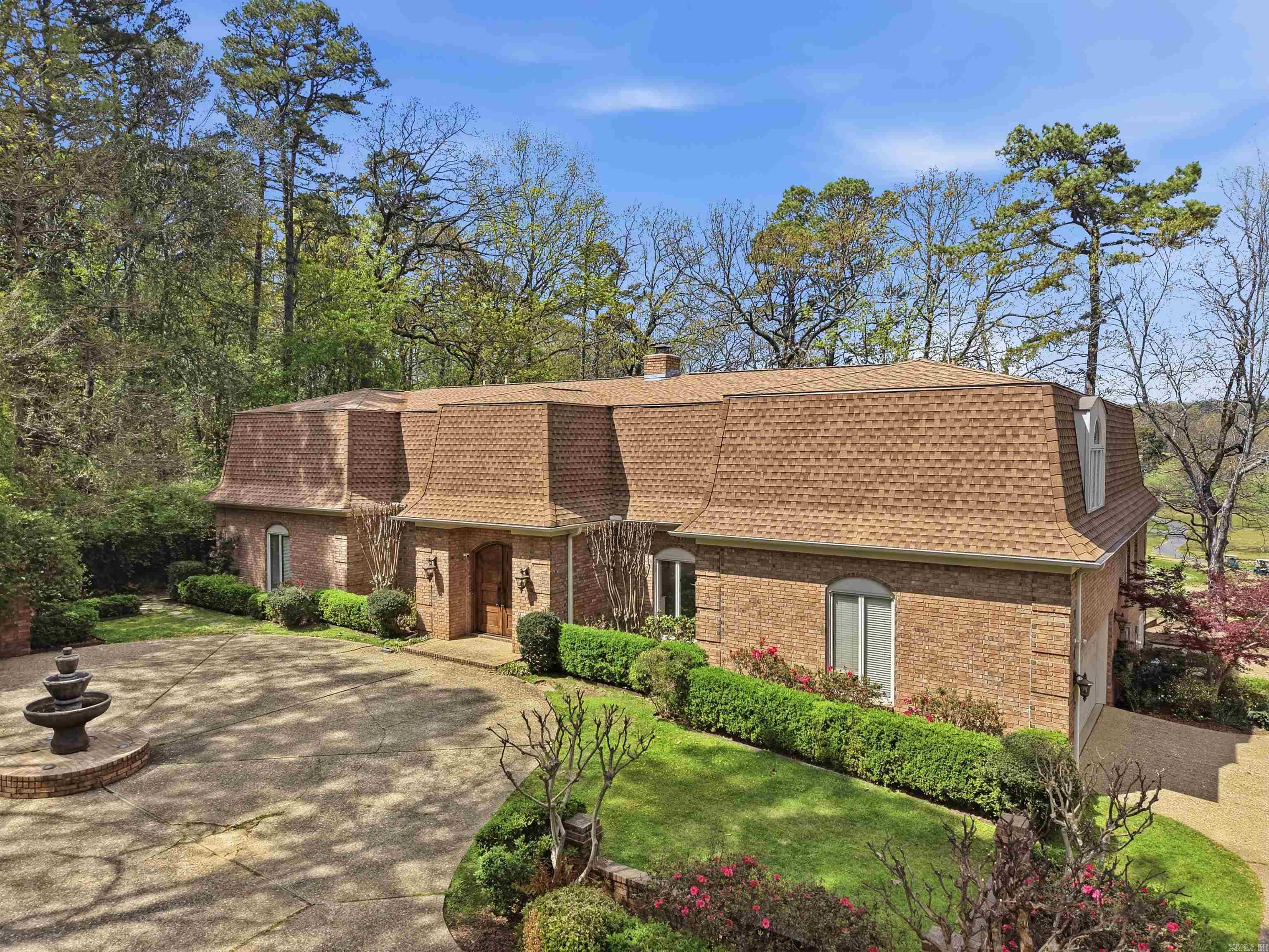 Iconic home with custom features, amenities with one of the very best golf course views overlooking the 8th green of the Pleasant Valley Golf course on an oversized private lot. This home welcomes you through wooden front doors into a gracious foyer with 10-foot ceilings & site-finished hardwood floors throughout the main level. The great room room features original wood beams, a handsome gas fireplace & large windows with incredible natural light offering incredible views of the patio and golf course. The formal dining room is ideal for gatherings with friends and family. The updated kitchen offers a new backsplash, gas range, double ovens, two Fisher & Paykel dishwashers, ice machine, beverage refrigerator, a breakfast nook & sitting area. The primary suite is positioned on the main level which includes a fireplace, spa-like bath, two walk-in closets & laundry room. Upstairs offers 3 additional bedrooms and two bathrooms. Outdoor living includes a recently renovated gunite pool, patio & sweeping golf course views. Recent improvements include a new roof, skylights, gutters, HVAC, ductwork, & more!