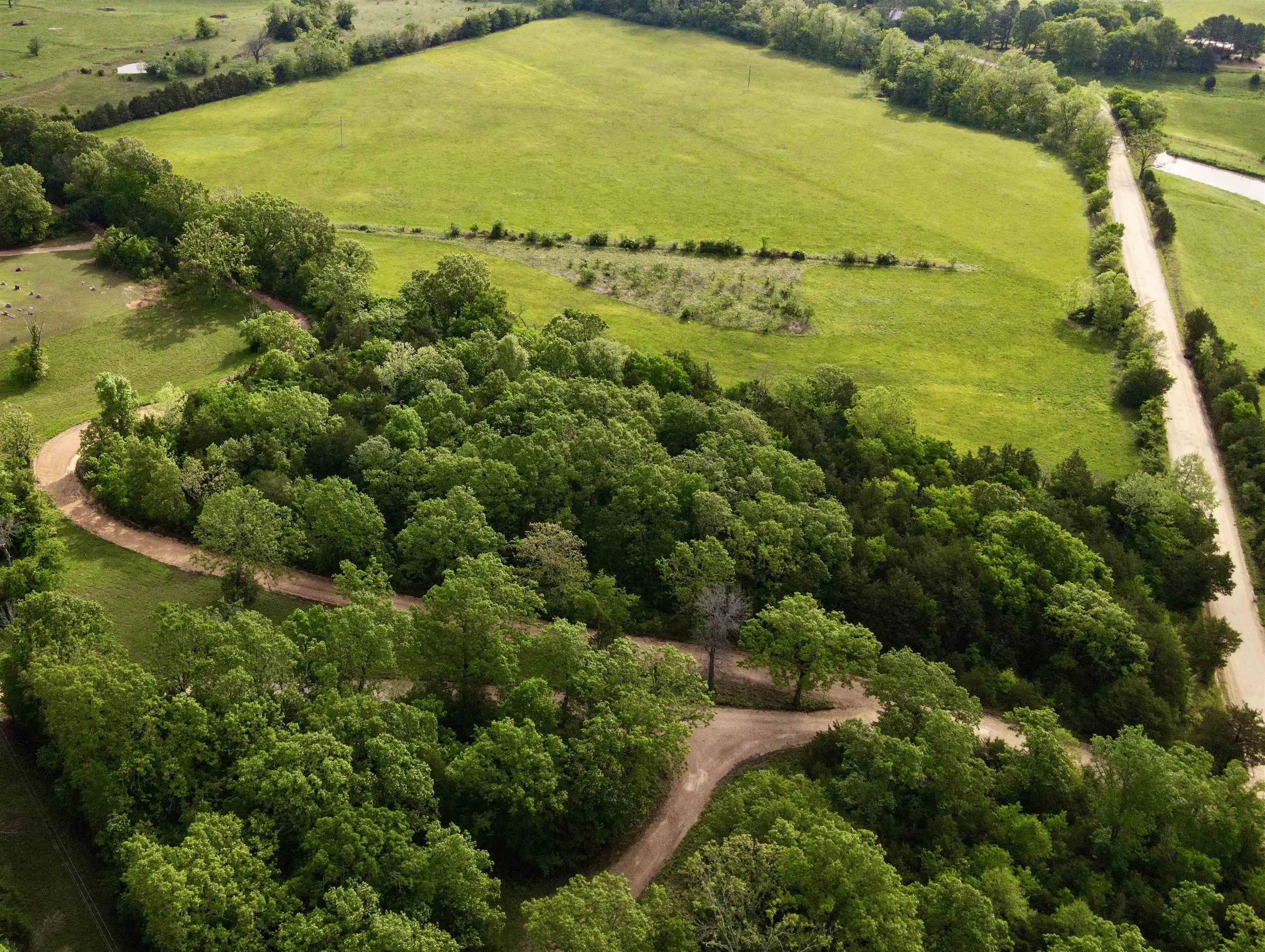 Discover the ultimate Ozark retreat with this stunning 54-acre M/L riverfront estate situated on the banks of the Strawberry River. Boasting approximately a quarter-mile of direct river frontage, this versatile property features 40 acres of highly productive river bottom hay and pasture land, complemented by a scenic mix of mature hardwoods and cedar. With electricity already on-site, multiple prime building locations, and easy access via county road frontage just off the pavement, this land is as functional as it is beautiful. Whether you are looking to establish a permanent homestead, a working farm, or a private getaway, the potential to subdivide makes this a rare and flexible investment opportunity. Outdoor enthusiasts will find their paradise here, with opportunities for fishing, canoeing, and swimming right in the backyard. The diverse landscape serves as a natural corridor for local wildlife, offering premier whitetail deer hunting and nature watching. Perfectly positioned for regional recreation, you are within a 45-minute drive of Lake Norfork, the Spring River, and the world-famous White River. With incredibly low taxes (only $84.87 last year) and riverfront acreage.
