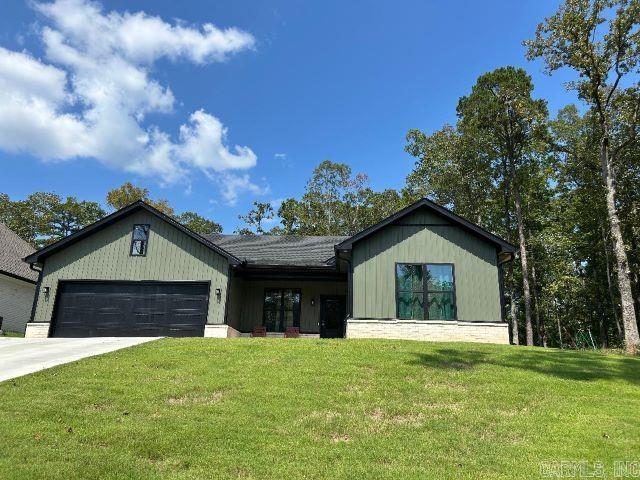 Welcome to this three bedroom, two bathroom home located in the gated Diamondhead subdivision. The home also features an open floor plan with an eat-in kitchen. The home also features a large covered back patio, two car garage, and built-in microwave.  Custom tile shower in primary bathroom and large master closet connects the laundry room. Diamondhead amenities include, 18 hole PGA golf course, Olympic size swimming pool, tennis/pickleball court, basketball court, pavillion area, playground area, disc golf course, country club with bar and grill, Lake Catherine boat launch and lake access point and hiking at Lake Catherine State Park approx 2 miles from DH entrance. Lakeside School District. One small pet allowed. Rent is $2200 Deposit is $2450.