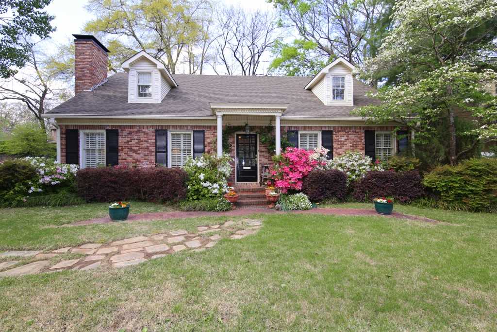This is a wonderful home on a corner lot near the Country Club of Little Rock.  The home has charming front and back yards.  Primary bedroom down with a remodeled bathroom and spacious walk in closet with laundry hookups.  two more bedrooms upstairs with hall full bath.  Sunny open kitchen/den area with a wood burning fireplace.  Formal living room with fireplace and a beautiful dining room. Two car carport on a corner lot.