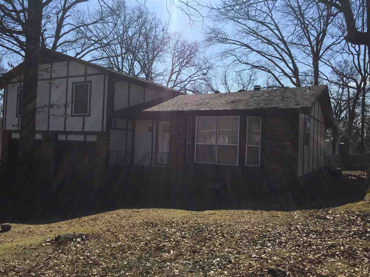 This home is in a awesome location, Oakbrooke Schools  Floor plan offer great room W/beamed ceilings and fans Fireplace with gas starter Carpet was replaced a few years, large deck and fenced in yard PRICED to sell as is no repairs, opportunity to get into a well established subdivision at a reduced price.  Laminate flooring in kitchen, cabinets  professionally painted bathrooms are tiled and some updates were completed. Garage with storage area sprinkler system- condition not known.