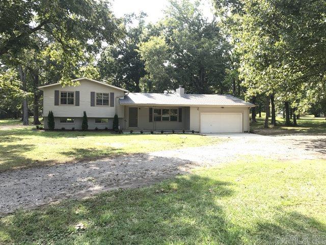 Welcome home to the country! Qualifies for USDA Rural Development Loan! This completely updated, 3 bedroom, 2.5 bath home sits on beautiful acreage with hardwood trees, 2 storage buildings, a huge patio, & much more! The greatroom has a wood burning stove, built-ins & is open to the formal dining room area. The kitchen has new appliances, cabinets, & a breakfast area. The beautiful original hardwood floors were restored & flow throughout the house except for new tile in the wet areas. Look at the photos!