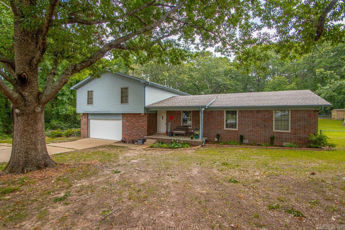 Privacy, space, and your own backyard oasis—all just minutes from town! This beautifully updated home sits on a level, private 1-acre lot and offers room for everyone! Flexible floor plan with 4 large bedrooms (lower-level bedroom does not have a closet) or 3 bedrooms plus a bonus room!  LVP in main living areas '20 and NEW carpet upstairs '26!  The updated kitchen is loaded with cabinets, granite countertops, breakfast bar, built-in cooktop, double wall ovens, built-in microwave, separate ice maker, and plenty of prep space! Both full bathrooms were completely updated in 2021 with double vanities and gorgeous custom tiled showers.  The spacious primary suite features private access to the back deck overlooking the backyard. Outside, you'll love the large, flat, fully fenced yard! Cool off in the new above-ground pool (2025) with surrounding deck, relax by the peaceful fountain and goldfish pond, or enjoy the wide-open space for kids, pets, and entertaining. Storage building conveys, too!  If you've been looking for an updated home with room to spread out, great outdoor living, and the convenience of being close to town, this one is a must-see!