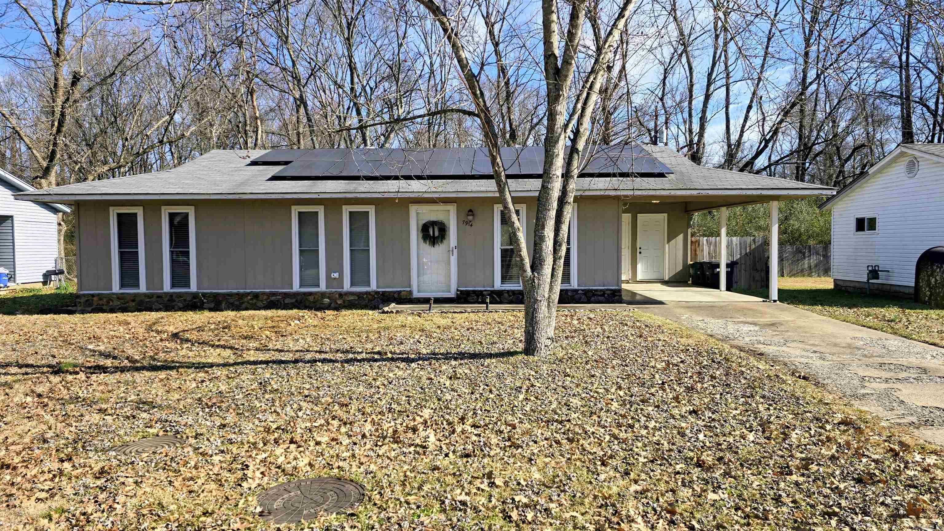 Cute cute cute!! This home is a showplace!   Spacious Living room.  New Vinyl flooring 2024.  Solid surface kitchen countertops.  Gas range.  Stainless Steel appliances.  Subway tile backsplash.  Kitchen island stays.  Dining area.  Updated bathroom. Tile shower.  Electric bill is only $20 per month with solar panels. Large level fully fenced backyard.  Extra storage closet in carport.  Walking distance to Park with  pool, playground, pickleball, workout. Please see agent remarks.