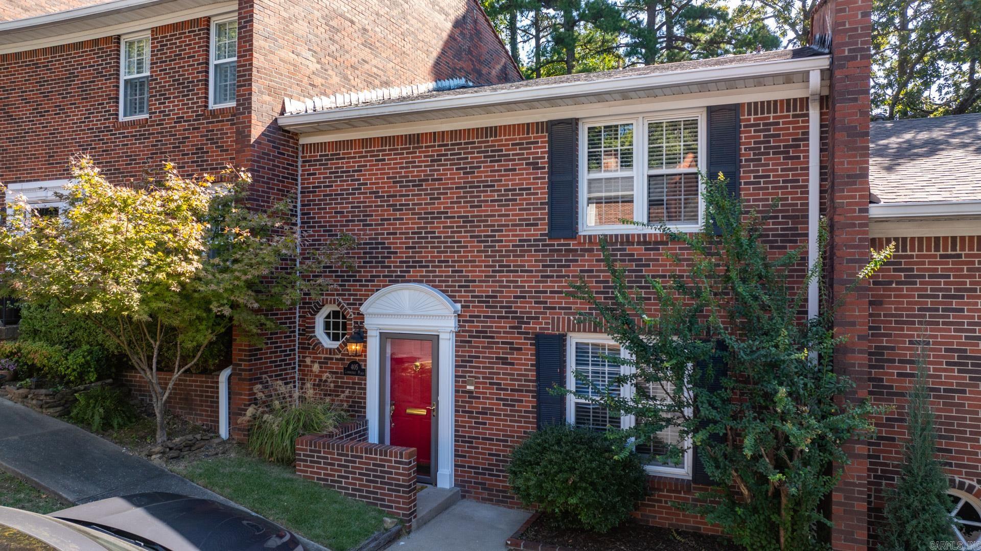 **NEW PRICE** This is an incredibly quaint Cambridge Place cottage. Don't miss a fantastic opportunity to make this precious condominium your own.  Brand new engineered hardwood floors just installed throughout the lower level.  Entry opens to a pretty stairwell and high ceilings.  Option for living/dining combo.  Gorgeous stone fireplace could be used as dining or a second living space, which opens to an oversize and peaceful outdoor deck/patio with lovely landscaping and an outdoor sprinkler system!  Handsome tiled kitchen with an option for a small breakfast nook. New stainless steel appliances, including an under-counter built-in wine cooler.  Generous pantry and cabinetry.  Custom built-ins.  Two en-suite bedrooms and baths up with lots of closet space.  Larger primary suite offers plenty of space. Beautiful built-ins both downstairs and upstairs.  Downstairs hallway features a powder bath and storage space, along with laundry.  Cozy with charm galore in a perfect location! So much to love!  Come see today!