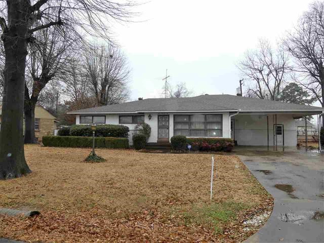 Large home in established neighborhood with 3 bedrooms, 3 full baths & a gas-log fireplace in the 2nd living room. Home sits on approx. .62 acres with a workshop.