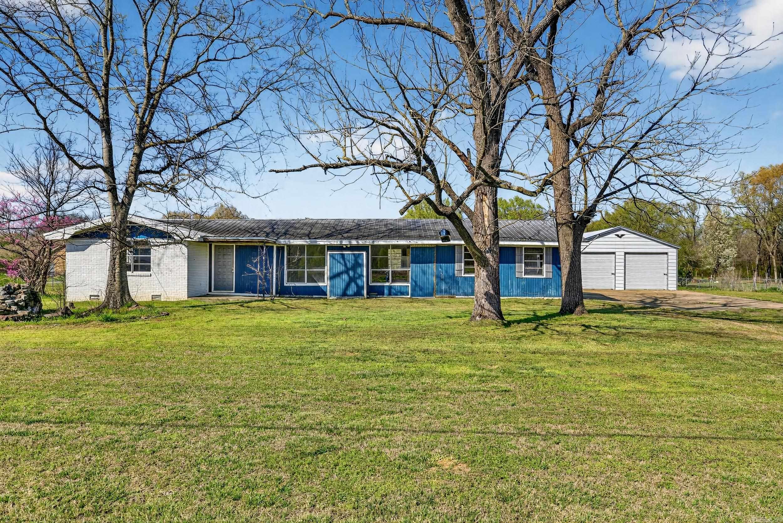 Investor special with incredible potential! This 4 bedroom, 2 bath home offers 2,085 sq ft of living space and sits on a full 1 acre lot, providing plenty of room to create something truly special. The home has been completely stripped down and is ready for a new owner to bring their vision to life. Major value-add features already in place include a metal roof, newer HVAC unit, and tankless hot water heater, giving you a great head start on renovations. New windows are also included with the property but have not yet been installed. Inside, you'll find a huge living area with great layout potential for modern updates. Outside, the property features a 24x24 shop perfect for storage, hobbies, or workspace, along with a fully fenced yard offering privacy and plenty of space. Whether you're looking for your next flip, rental investment, or custom renovation project, this property offers a rare opportunity with strong upside on acreage. Bring your ideas and transform this property into something amazing!