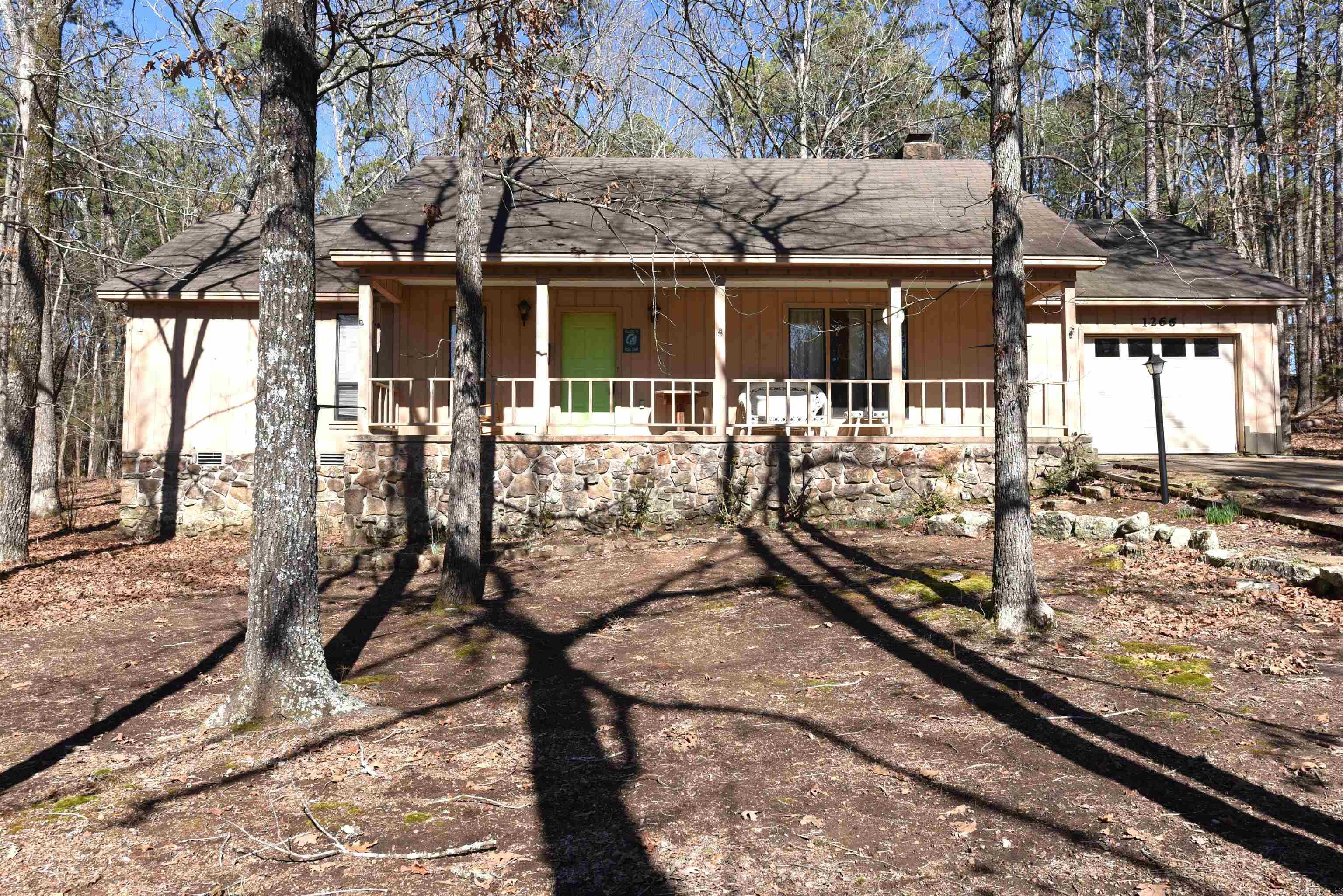 A RARE FIND, a modestly priced 2-bedroom, 2-bathroom home with a BOAT SLIP in HAMILTON COVE.  The dock is in the process of renovations and will be immensely improved.  The assessment is PAID!  With some updating, this would be a phenomenal property or if you prefer, this furnished lake home is move in ready.   The home has an impressive stone fireplace & hearth, large living room, spacious, fenced backyard, generous closet space, inviting front porch, and a convenient garage.  Located on a 1/3-acre lot, this property offers privacy, convenience and the Hamilton Cove dock & pool are right around the corner.  Located in the picturesque, resort community of Fairfield Bay, AR, this is truly an unpolished diamond waiting on you to make it shine.  Area amenities include two golf courses, three pools, ATV trails, hiking/biking trails. pickle & tennis courts, full-service marina, bowling alley, mini golf, multiple dining options, live music & entertainment venues and located on the pristine shores of Greers Ferry Lake. This is YOUR opportunity to live your best life.  Agents see remarks regarding the boat slip and the year the home was built.