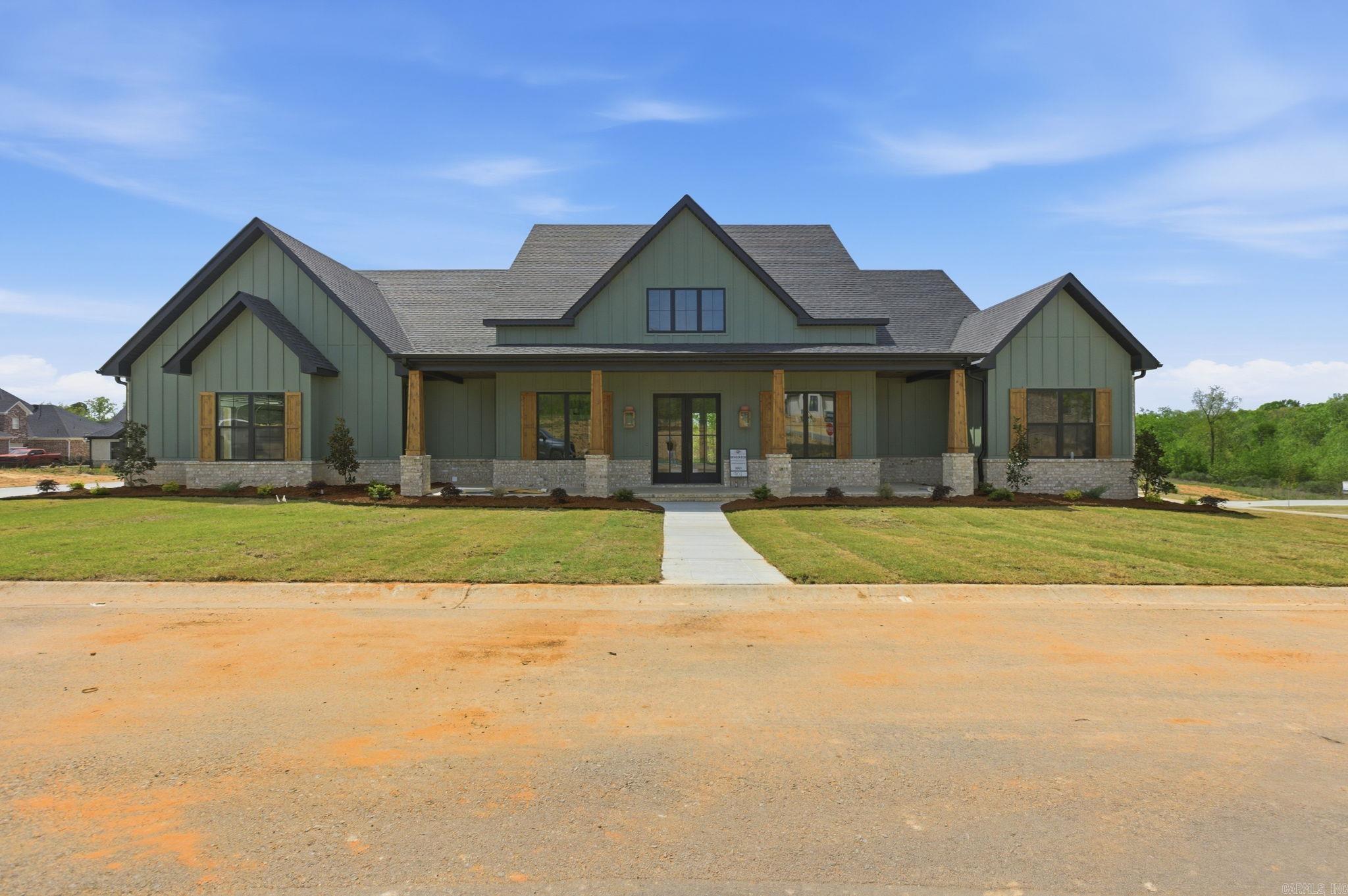 Welcome to 901 Cimarron Cove in Benton, Arkansas! This stunning home offers 4 bedrooms, 4.5 bathrooms, and a large bonus room that could easily serve as a 5th bedroom with it having its own bath and walk in closet. The spacious living room features vaulted ceilings and a cozy gas log fireplace, creating the perfect place to gather and relax. The primary suite is a true retreat with tray ceilings, a large bedroom, a spa-like bath, double walk-in closets, and a dedicated makeup counter.  Designed for both everyday living and entertaining, this home also features a private office, separate dining area, and a beautifully equipped kitchen with a gas range, pot filler, built-in microwave, wall oven, double pantry, and an additional sink. Luxury vinyl plank flooring runs through the main living areas, with tile in the wet areas for durability and style. The oversized laundry room offers plenty of counter space and storage, and the 3-car garage provides ample room for vehicles and equipment. Enjoy the efficiency of a tankless water heater and step outside to a large back deck with an outdoor fireplace overlooking a large lot of over half an acre.