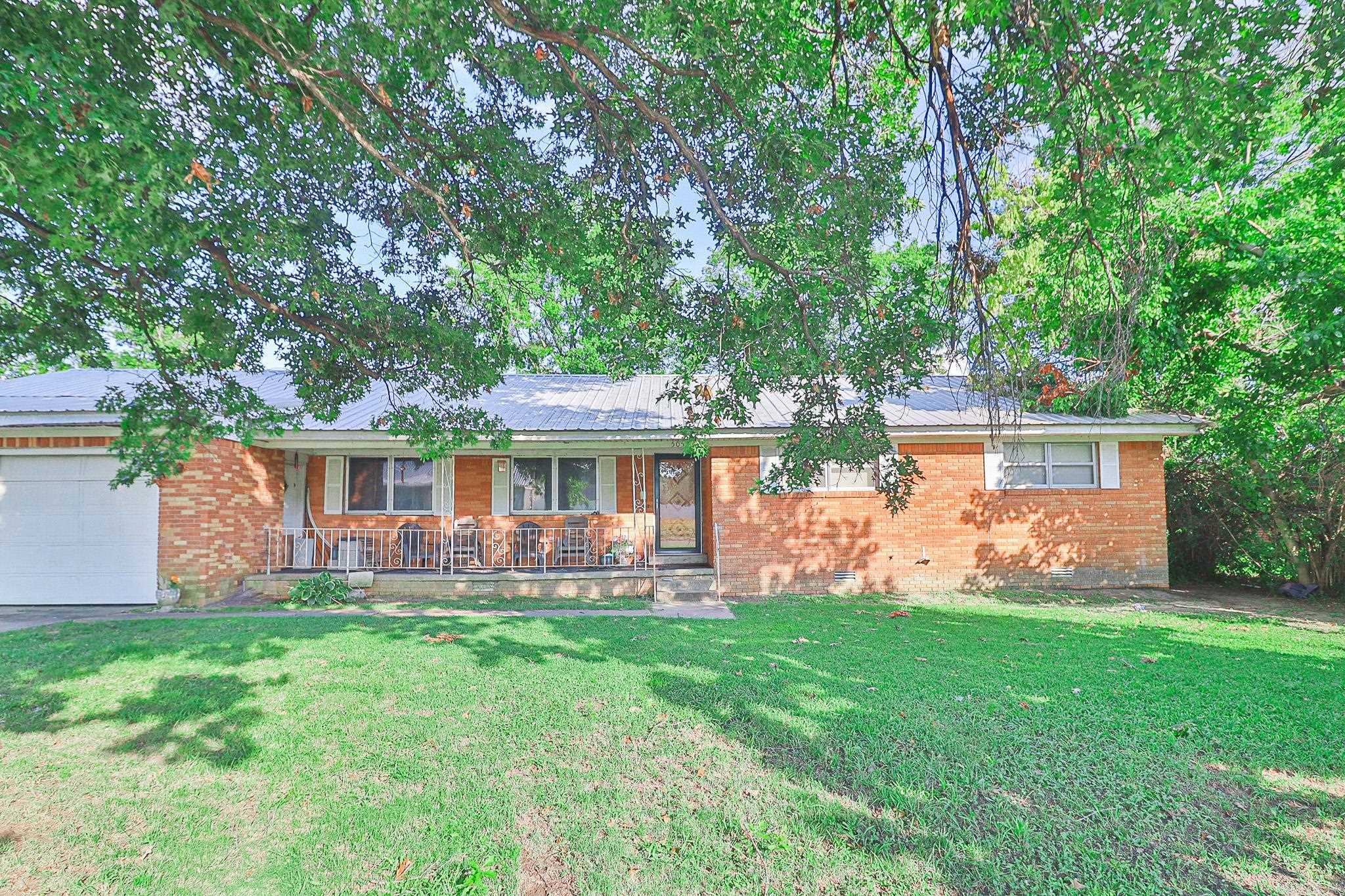 Looking for a place that feels like home from the moment you arrive? You've found it! Welcome to 505 7th Street in Marked Tree! This spacious home features 3 extra-large bedrooms, 1½ baths, and a partially completed en-suite bathroom off the primary bedroom with the shower already installed and the new toilet and sink included. The open-concept floor plan offers a large living room, dining area, and kitchen with a gas stove, dishwasher, and refrigerator that all stay. New flooring has been installed throughout most of the home, with materials included to finish the remaining hallway section. You'll also enjoy a mudroom with washer and dryer connections, a bonus room perfect for an office or hobby space, and a climate-controlled room off the garage ideal for a music room, craft room, or workshop. Additional features include two water heaters, central heat and air, and gas heat. With a little TLC and many supplies already on site, this home offers a wonderful opportunity to add your personal touch and make it your own.