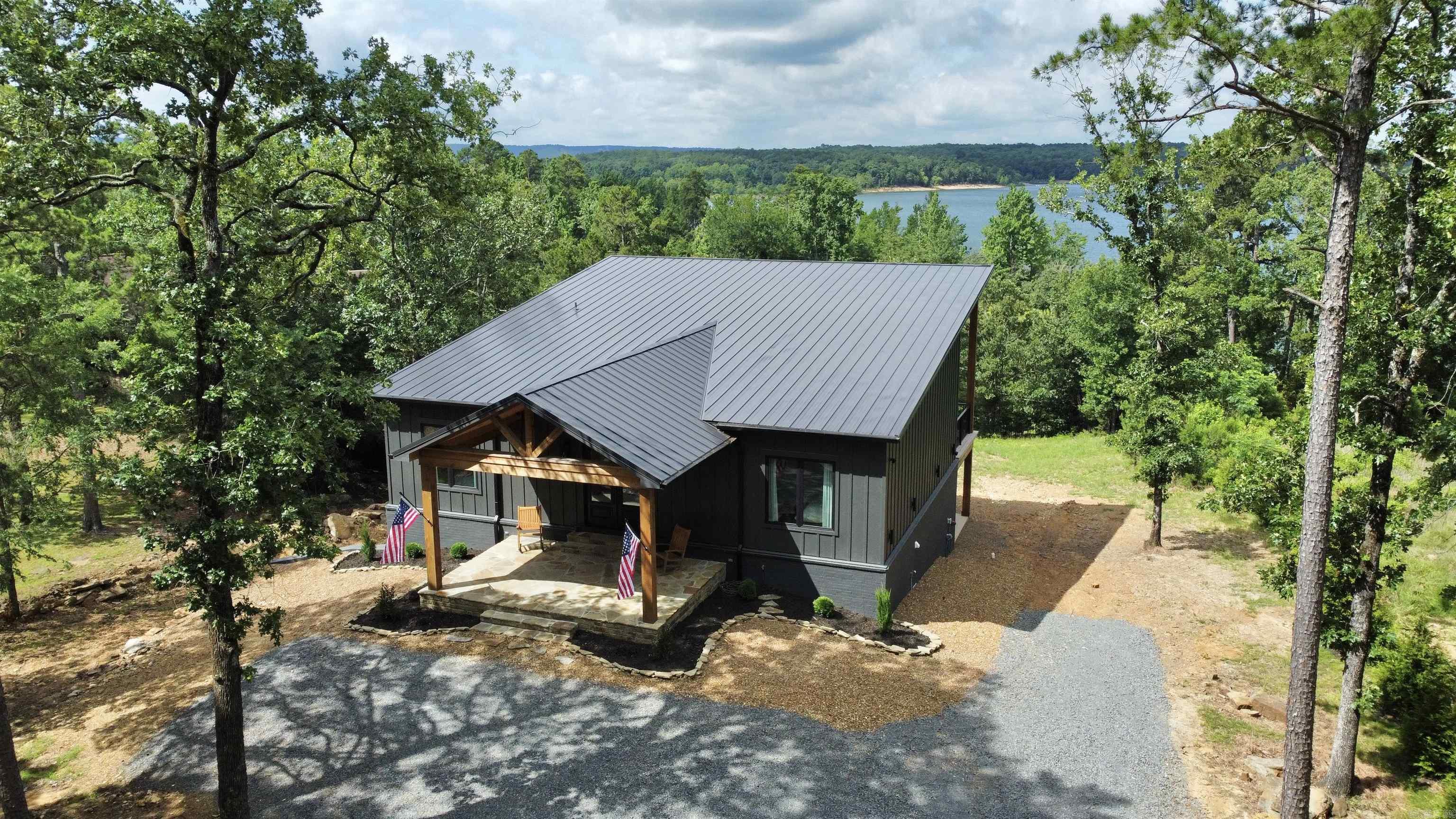 Don't wait to checkout this Stunning Custom Built Lakefront Home, Fully FURNISHED that also includes all appliances, tv's, etc. with 12'-15' ceilings throughout the kitchen/living room areas, walk in-pantry w/drink cooler & microwave, double oven, plenty of windows to capture the lake views of Greers Ferry Lake, white oak custom cabinets (built by the well known "Henegar Cabinets", home built by Bridgbilt Builders), Quartz countertops throughout w/exception of the leathered granite countertops in the Primary Bathroom, 4 bedrooms, 3 full baths, 10ft. ceilings in the bedrooms upstairs w/8ft. tall solid wood doors, 9ft. ceilings downstairs w/walkout basement, 2nd living/gameroom area downstairs, built in bunkbeds that sleep 8 people in one room, surround sounds speakers (inside & out),security system installed, 12x40 Utility room w/side load garage, Seamless Metal Roof, Fiber Optic Internet through "Connect2First" & more ! See "documents" online under "docs", taxes TBD, & also checkout the links for Video & Walkthrough tours.