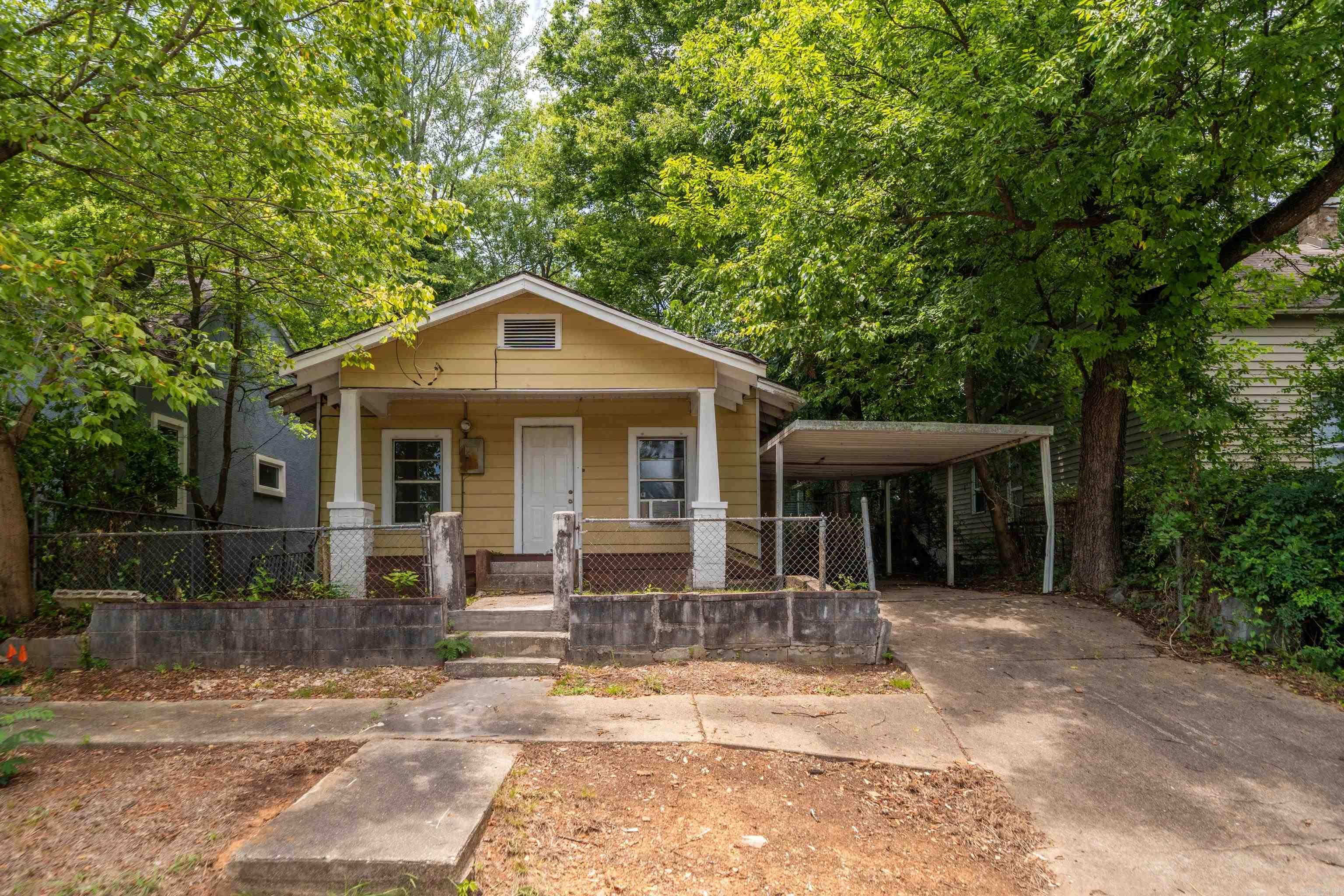 Fresh updates make this 3-bedroom, 1-bath home move-in ready. Recent improvements include brand new flooring, fresh paint, sheetrock repairs, new tile, updated countertops, freshly painted kitchen cabinets, and a brand new front deck overlooking the park.  Start your mornings with a cup of coffee on the front porch while enjoying peaceful views of the park, or take advantage of the playground just across the street. The home also features a covered carport and offers a convenient location close to everyday amenities.  Whether you're looking for your first home, an investment property, or an affordable place to call home, this property offers great value with many of the major cosmetic updates already completed. Come see everything this home has to offer!  *Being sold as-is