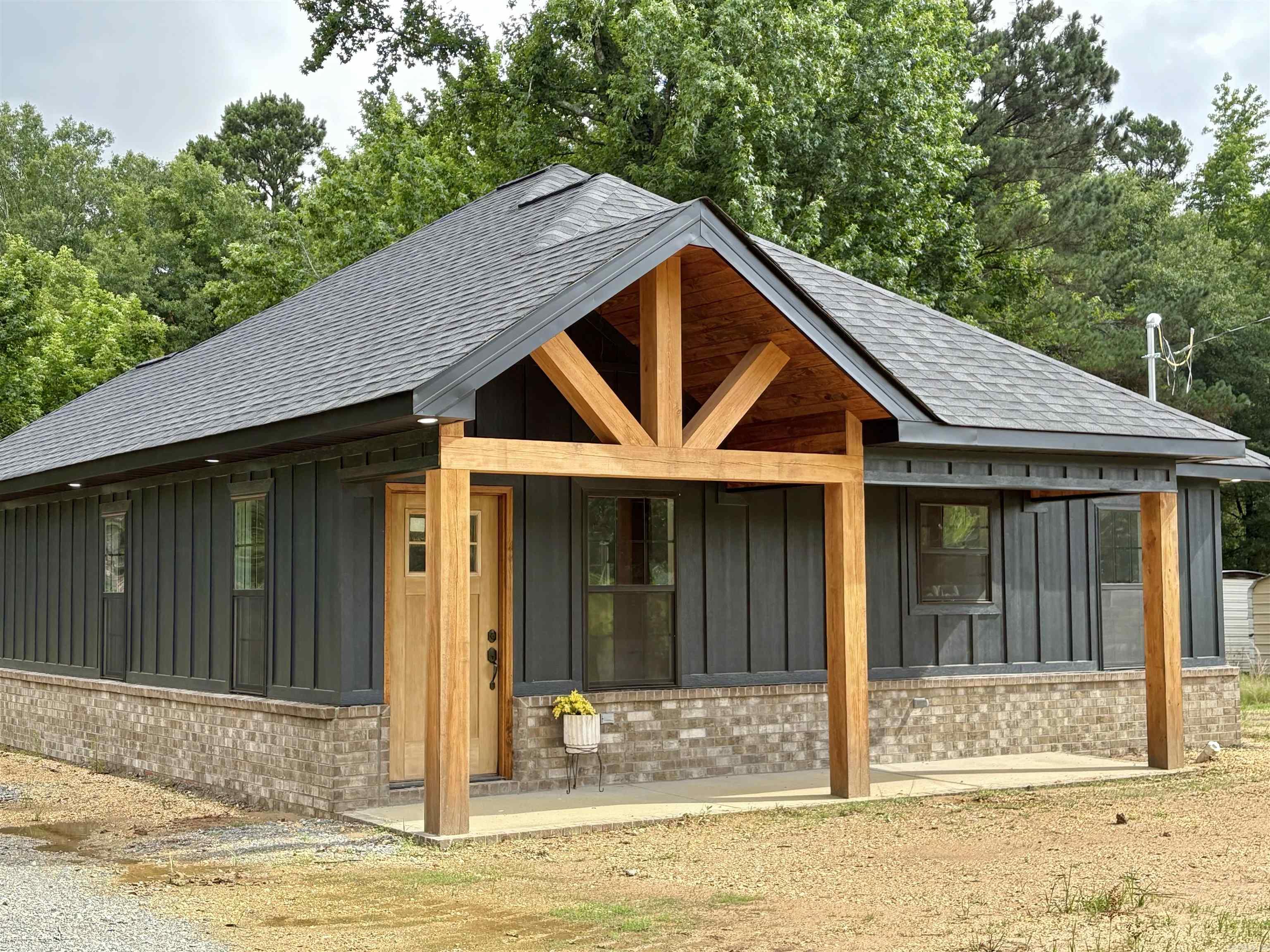 Welcome to this beautifully crafted new construction home, where modern comfort meets rustic charm! The exterior features hardy board siding & craftsman style cedar posts on front & back porches.  Step inside to find a stunning wood accented fireplace & ceiling, creating a warm and inviting atmosphere. The custom tiled showers add a luxurious touch, while the spacious 2 bedroom layout ensures comfort & functionality.  A large laundry area off of the kitchen, completes the flow of this thoughtfully designed home.  Enjoy the peaceful outdoors on your new back porch at 8101 Sulphur Springs Rd.  Schedule your showing now! Finishing touches are being completed: floors are being grouted and finished along with countertops and faucets, lighting & hardware. Pics to be updated throughout completion.
