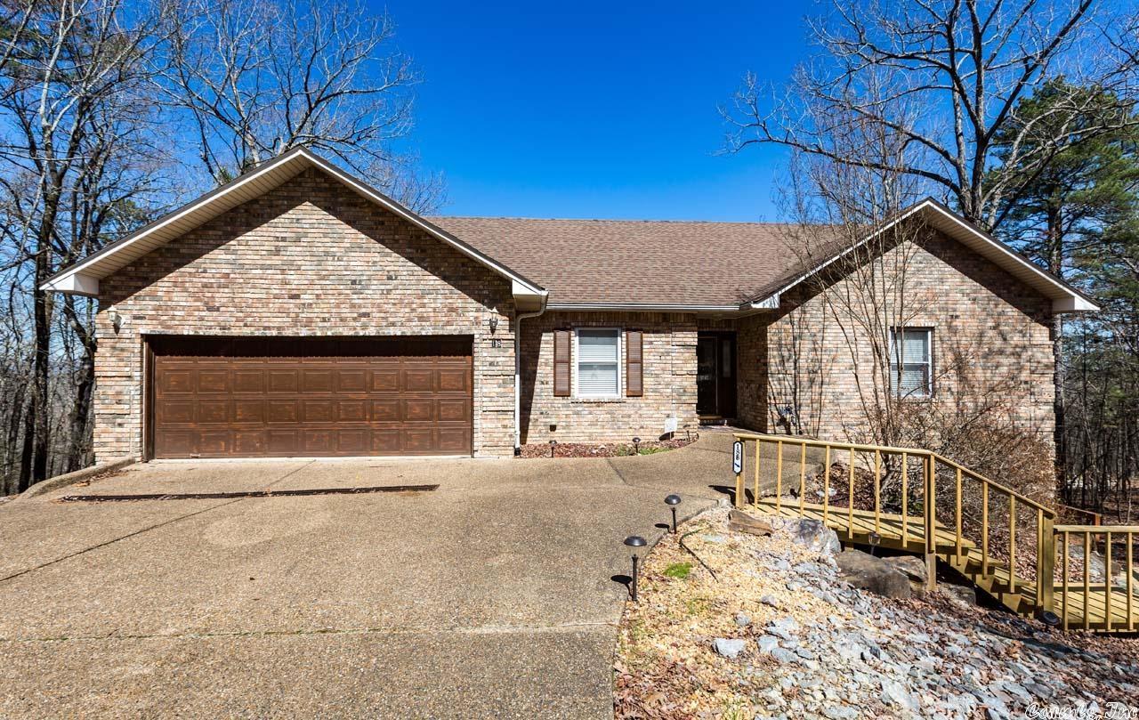 This exceptional "two homes in one" can be the perfect set-up for in-laws or investors or to give your guests privacy. Tons of windows to enjoy the spectacular view of mountains and Lake DeSoto! Main level features 3 BR/2 BA, open living/dining area with vaulted ceiling & corner fireplace, spacious kitchen & breakfast room. Granite counters & gleaming hardwood flooring throughout main level w/tile in baths. Jetted tub & big WIC in primary suite. Lower level accessed from inside or out gives you lots of options! 1 BR/1BA with another massive room that can be 2nd BR, office, craft rm....the possibilities are unlimited! Large open living/dining, kitchen, laundry and a full bath with walk-in shower create a comfortable living space! Great decks, up & down to enjoy outdoor living & the beautiful view. Fully fenced backyard, two car garage & parking pad plus new stairs outside to access lower level. Lower level has lease through May 31st and will be transferred to buyer at closing. Safe room on lower level. See agent remarks for additional details.