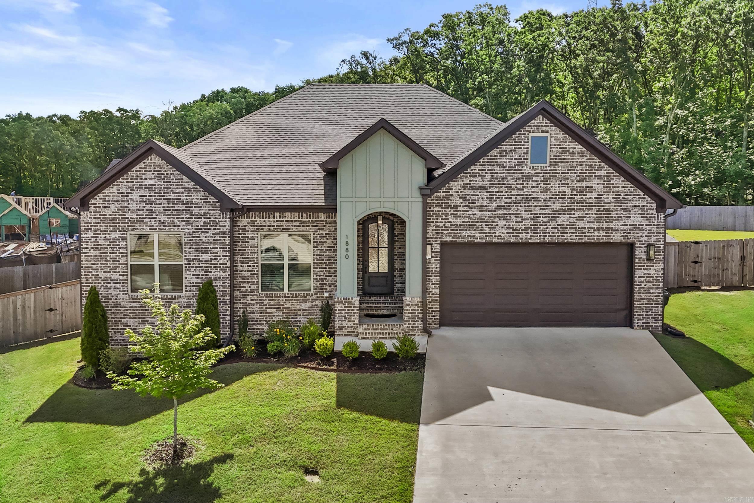 Built in 2024 and looking brand new, this stunning home, with upgraded finishes is a better built home by Tom Watson. Home is nestled on a quiet cul-de-sac in a highly desirable neighborhood, with easy interstate commute and proximity to points of interest, making this location ideal. Inside, you'll find 4 bedrooms, 2.5 baths, and a spacious, open layout with white trim, versatile warm off-white paint, faux wood blinds, and dark wood-look tile flooring throughout, making a lovely contrast and complementing the design. Home is bright and fresh! The kitchen dazzles with beautiful quartz countertops, white cabinets, a striking backsplash, a new kitchen faucet, and a large pantry. The expansive private master suite is separate from the other bedrooms, offering a large retreat bathroom and a huge walk-in closet. Green features include low-E windows, radiant barrier roof decking, a tankless water heater, and 14 SEER HVAC. Lot has a slight uphill slope offering an elevated view, security and a serene tree-lined backdrop. Outdoors, enjoy a covered porch, patio, a fully fenced yard, a new rocked fire pit area with a Thermacell Live System for mosquitoes. This one-story gem is a must-see!