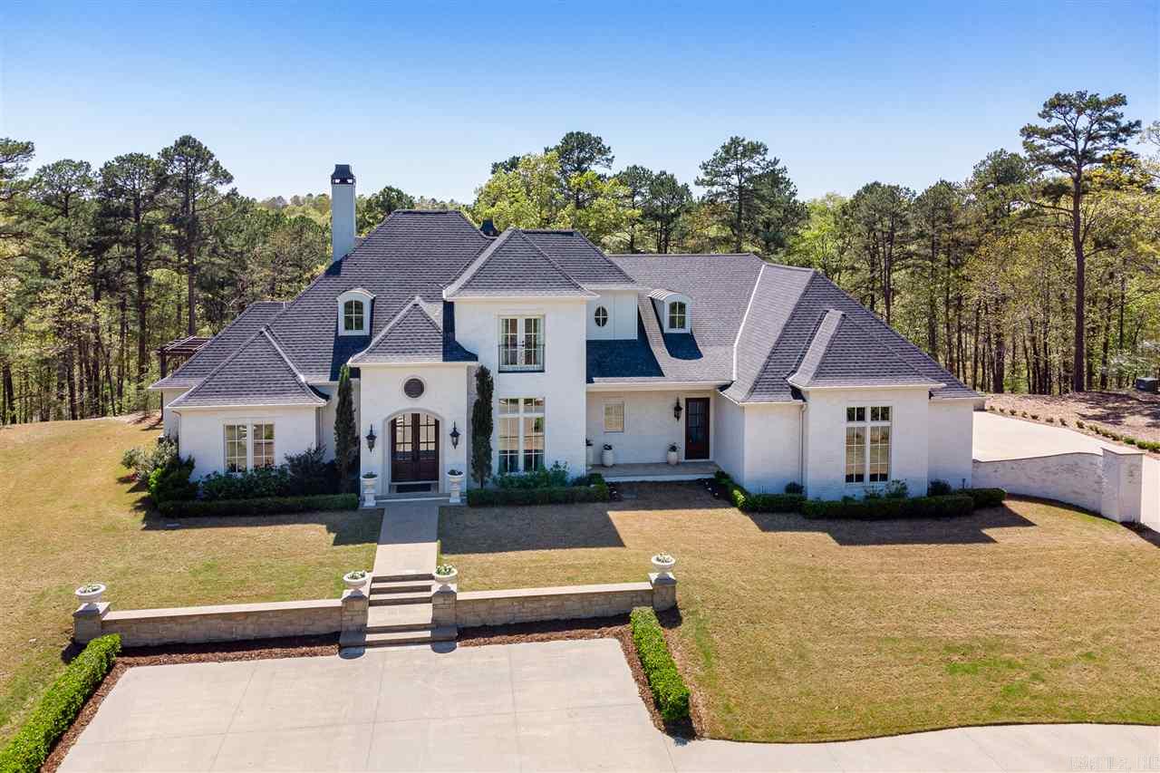 Breathtaking custom home beautifully situated on gorgeous 5.5 Ac mountaintop lot. An eye for design and function flows thru every room making this home easy to live and love. Thermador appliances, handcrafted island accents & plenty of cabinets in the gourmet kitchen. Superb main suite w/large closets & luxurious bath apart from 2 guest BDRMs & shared bath. Amazing living space w/FP and wall of windows overlooking the beautiful garden & outdoor living area. Two guest BDRMS w/Bath upstairs. Come See!