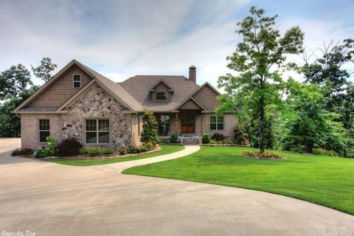 IMPECCABLE DETAILING & QUALITY in this custom home! Gorgeous, private setting with its deep green space. Fabulous views from the expansive great room with stone fireplace; Stunning, pine ceilings is open to the kitchen which has Bosch appliances, granite countertops and Alder cabinets.  Master suite shares the vista views and has luxury en-suite bath.  Custom closets throughout/Plantation shutters. Downstairs hosts family room; media; 2 bedrooms, bath & huge game room. Workshop & Storage! BETTER THAN NEW!