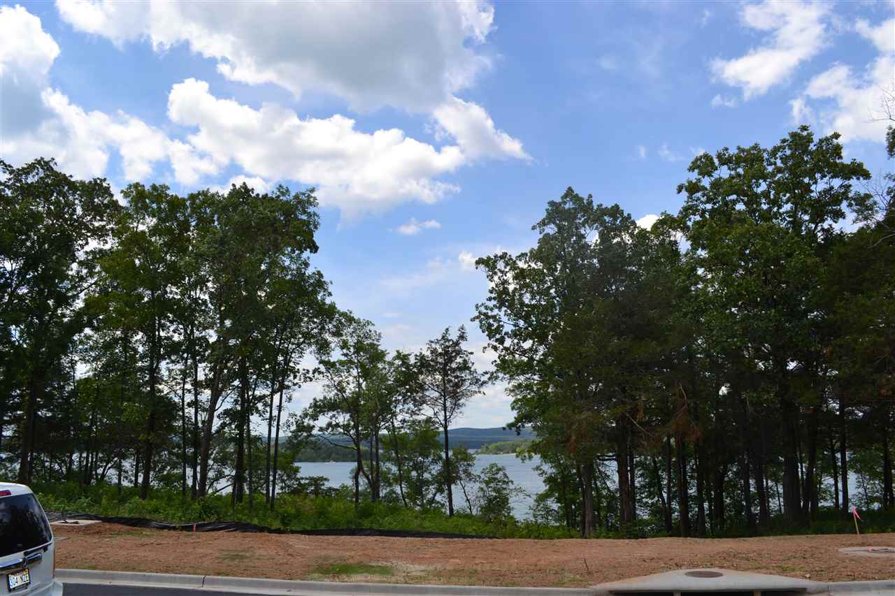 Spacious lakeview lot in gorgeous Wisdom Pointe!  The LAST waterfront pointe in Heber city limits @ Greers Ferry Lake! GATED, 16 TOTAL spectacular, spacious homesites  - 10 waterfront lots left w/ direct access & 4 water view lots left w/ dedicated trail to water. Great greenspace perimeters! Lots sit on top of bluff & are great flat sites. Fantastic stacked rock topography! All utilities at sites. Two water meters each. C&R tailored to rustic, natural designs. PARADISE! Great greenspace! WisdomPoint.com