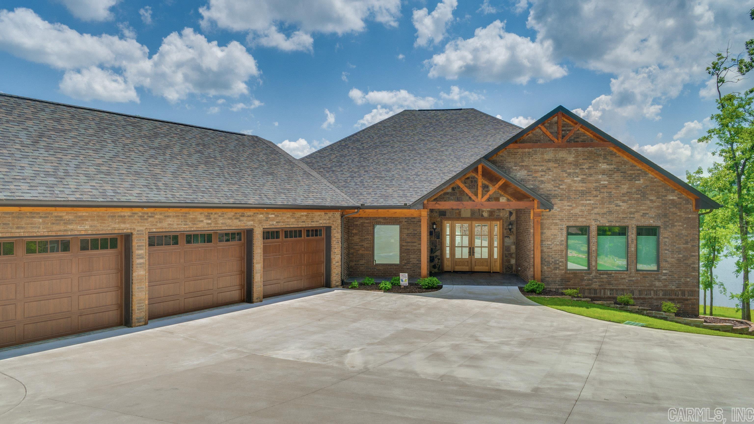 Custom Lake Balboa Home built in 2021 with 4244 sq. ft of h/c - Main level offers: 2 Bedrooms, 2 Baths, Study, Great Room, Kitchen/Dining, Laundry Room totaling 2659 sq ft for main living space. 3 Car Garage with 8'x12' doors, Mahogany front door, Andersen Low E Windows & Sliding Doors, Glass Baluster Railing on deck- Stamped Concrete Porch and Patio, Tiled Deck, Stained Fir eaves & porch & deck ceilings, Solid Wood Doors, Granite Counters, Kitchen: Custom Beech Cabinetry, soft close drawers, pull outs, induction cooktop, double ovens, w/i pantry- Primary Bath: 7 ft Tub, Rain Showerhead, Marble Vanities. European Oak Engineered Flooring Upstairs-  Lower level offers 1585 sq' of living space which includes:  Game Room, mini kitchen, bar, double slide wood doors to patio, Game Room, Family Room, Bedroom, Full Bath, Theater Room, Solid Walnut Wood Floors- Storm Shelter Area, loads of storage. Lennox HVAC- 7 Zones, 3 heat pumps, Avg. Electric Bill $143- 80 gallon heat pump water heater, whole house water filtration system. Sprinkler System, Professional Landscaping, All Brick with Aluminum Clad Facias- Cedar Wrapped Posts- $1,399,000 by appointment only.