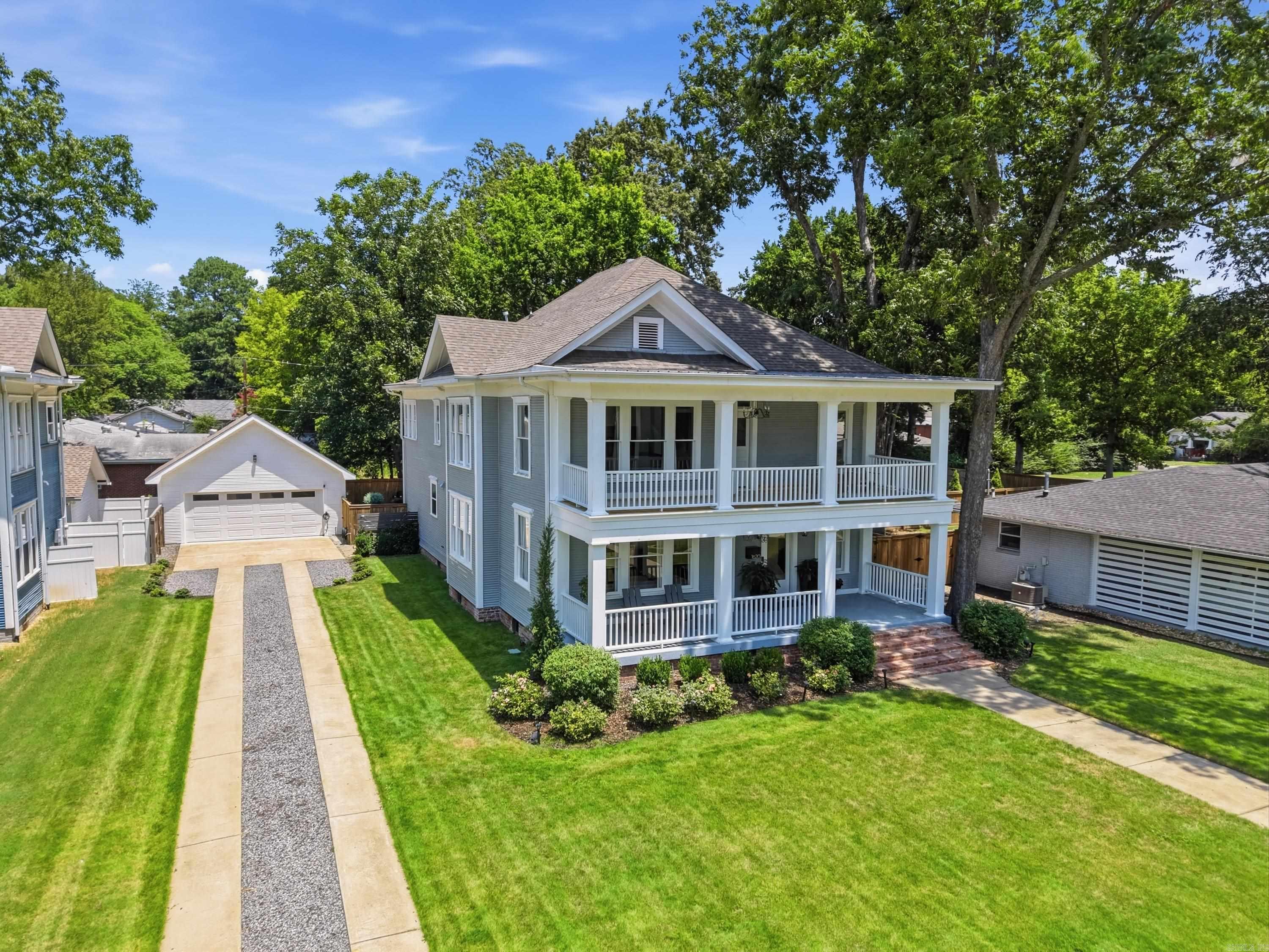 Beautifully renovated 4 bed/4.5bath Robinson Historic District home built in 1917. The welcoming front porch leads into the foyer & spacious formal living room. The chef’s kitchen features quartz countertops, beautiful tile, gas cooktop w/ pot filler, double ovens, large center island w/ bar seating & walk-in pantry. Just off the kitchen is a lounge/wine room w/ wet bar & second sitting area w/ double-sided fireplace. The formal dining room is filled w/ natural light & offers easy access to the back patio. Original hardwood floors, one full bath, one half bath & abundant storage complete the main level. Custom details include 9’ ceilings & beautifully restored floor-to-ceiling windows & trim. Upstairs you’ll find 4 bedrooms, including a luxurious primary suite w/ private balcony access. The spa-inspired ensuite features separate vanities & tiled wet room w/ soaking tub & walk-in shower. There are 3 additional bedrooms, 2 full baths, laundry room & spacious upstairs living area. Outside, enjoy the back patio, fenced in backyard, w/raised garden beds, extensive landscaping & sprinkler system. Two-car garage & storage shed complete this exceptional historic home.