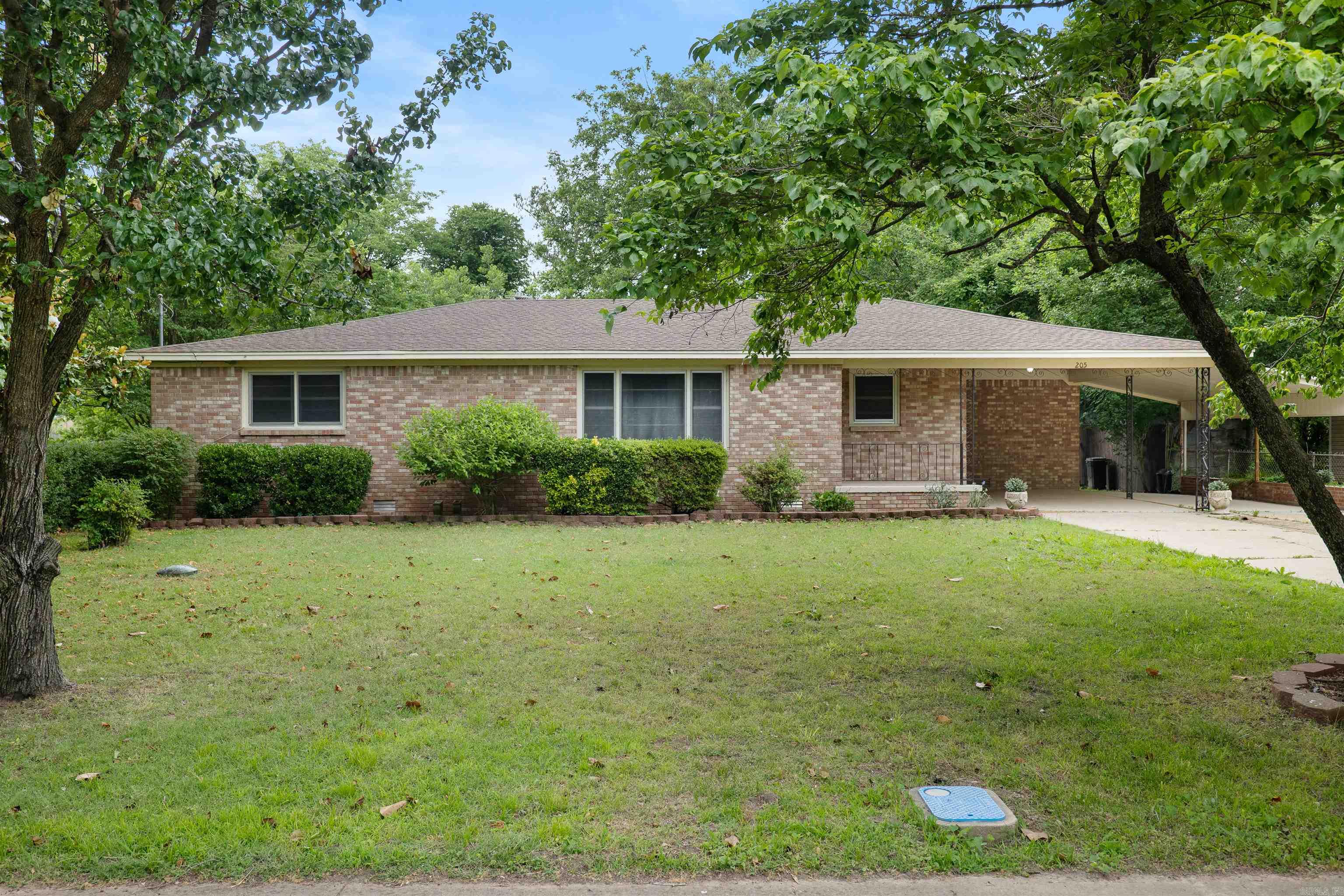 Welcome to Market 205 Central Ave in Bay! Built in 1963, this meticulously maintained mid-century modern brick ranch sits on a landscaped 0.20+\- acre lot and offers timeless character with thoughtful updates throughout. Exterior features include a 2-car carport, architectural shingle roof replaced in 2023, newer HVAC, and a 20x25 shop with roll-up overhead door. Inside, you’ll find 3BR/2BA, a spacious living + dining combo, dedicated office, laundry room, and an eat-in kitchen with beautifully crafted cabinetry. Original charm shines through with hardwood floors throughout much of the home, hardwood-paneled accents, vintage bath tile, and well-preserved mid-century details that are becoming harder to find. The functional layout offers both character and practicality with generous room sizes and abundant storage. A rare opportunity to own a well-kept home full of craftsmanship and personality! Call today to schedule your tour!