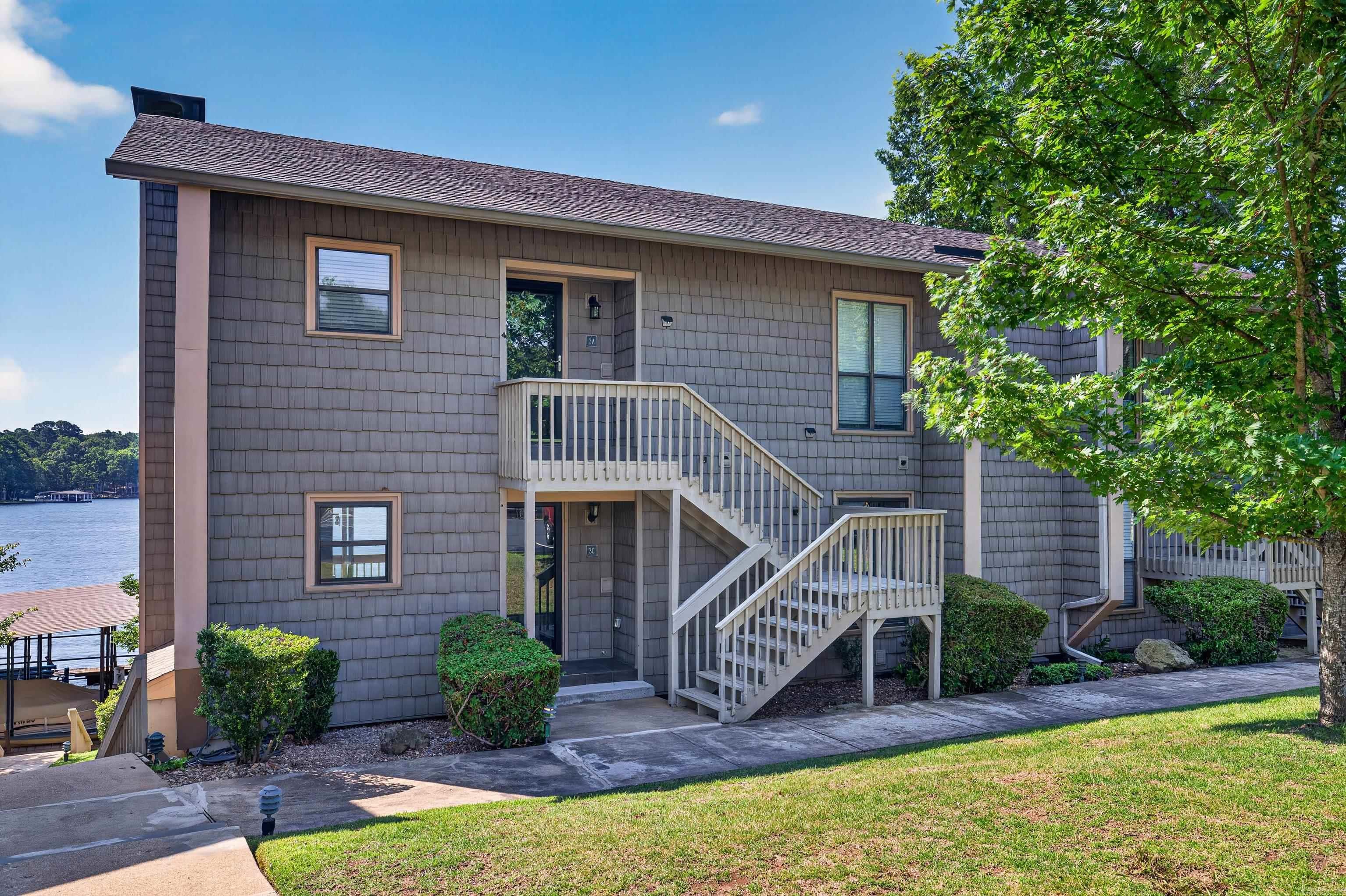 Enjoy effortless lakefront living in this beautifully remodeled 2 bedroom 2 bath waterfront condo. This ground-level, single story unit offers easy access with no stairs and showcases panoramic water views from the main living areas. The open, updated interior features quality finishes throughout, creating a fresh, modern feel that's ready for you to enjoy. Located in a desirable gated complex and includes a private covered boat dock. Whether you are looking for a weekend retreat, full time home or investment, don't miss this one!