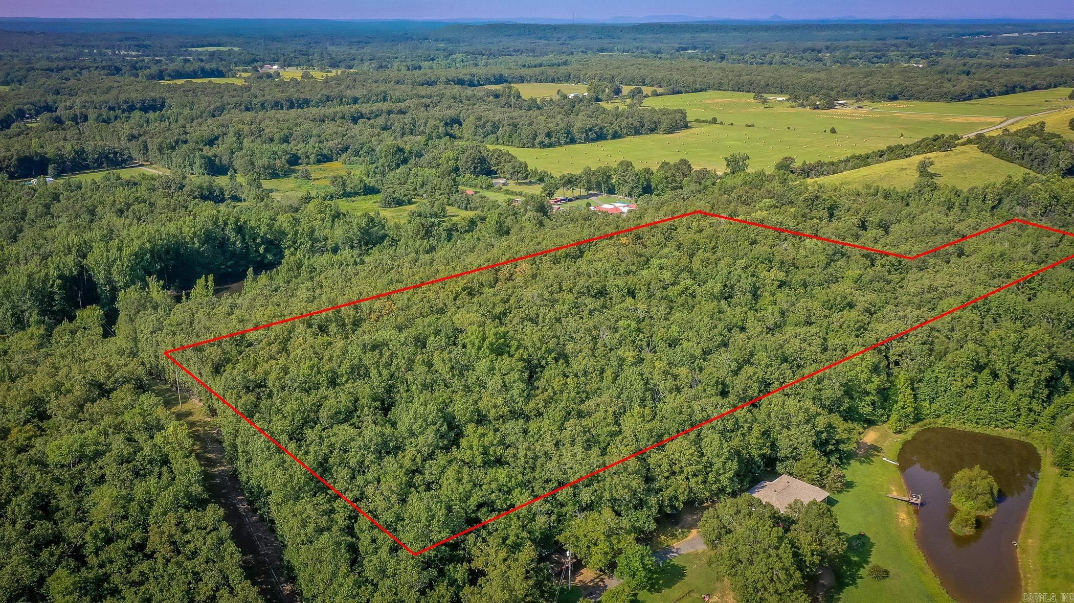 Nice 10.34 Acres of undeveloped land in Jacksonville with lots of hardwoods and wildlife on the property.  Enjoy your privacy and build your dreams whether it be a single family residence, private estate, or new development.  Electric, water and sewer are available at road. Location: just a few minutes from Little Rock AFB.  Acreage is wooded and has fantastic views.