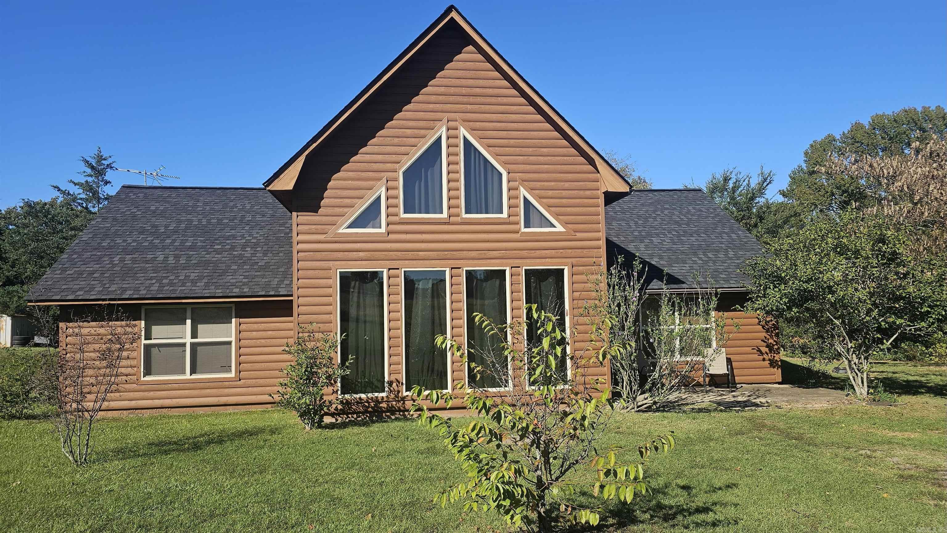 PRICE REDUCED!!! CUSTOM-BUILT LOG-SIDED HOME WITH 3 BEDROOMS & 2 BATHS AS WELL AS A LOFT THAT COULD SERVE AS ANOTHER BEDROOM OR AN OFFICE. LARGE OPEN ROOM WITH KITCHEN & LIVING ROOM AS WELL AS THE LOFT OVERLOOKING THE LIVING ROOM, BUT DIRECTLY ABOVE THE KITCHEN. SPLIT FLOOR PLAN. MINUTES FROM PINEY BAY RECREATION AREA CONVENIENTLY LOCATED BETWEEN RUSSELLVILLE & KNOXVILLE-LAMAR-CLARKSVILLE. LAMAR SCHOOLS, CITY WATER PROVIDED BY EAST JOHNSON COUNTY WATER USERS ASSOCIATION. ARKANSAS VALLEY ELECTRIC PROVIDES POWER & WAVE FIBER-OPTIC INTERNET. THERE ARE NINE FRUIT TREES IN THE YARD THAT PUT OUT PLUMS, APPLE, AND PEACHES! COUNTRY LIVING AT ITS BEST!