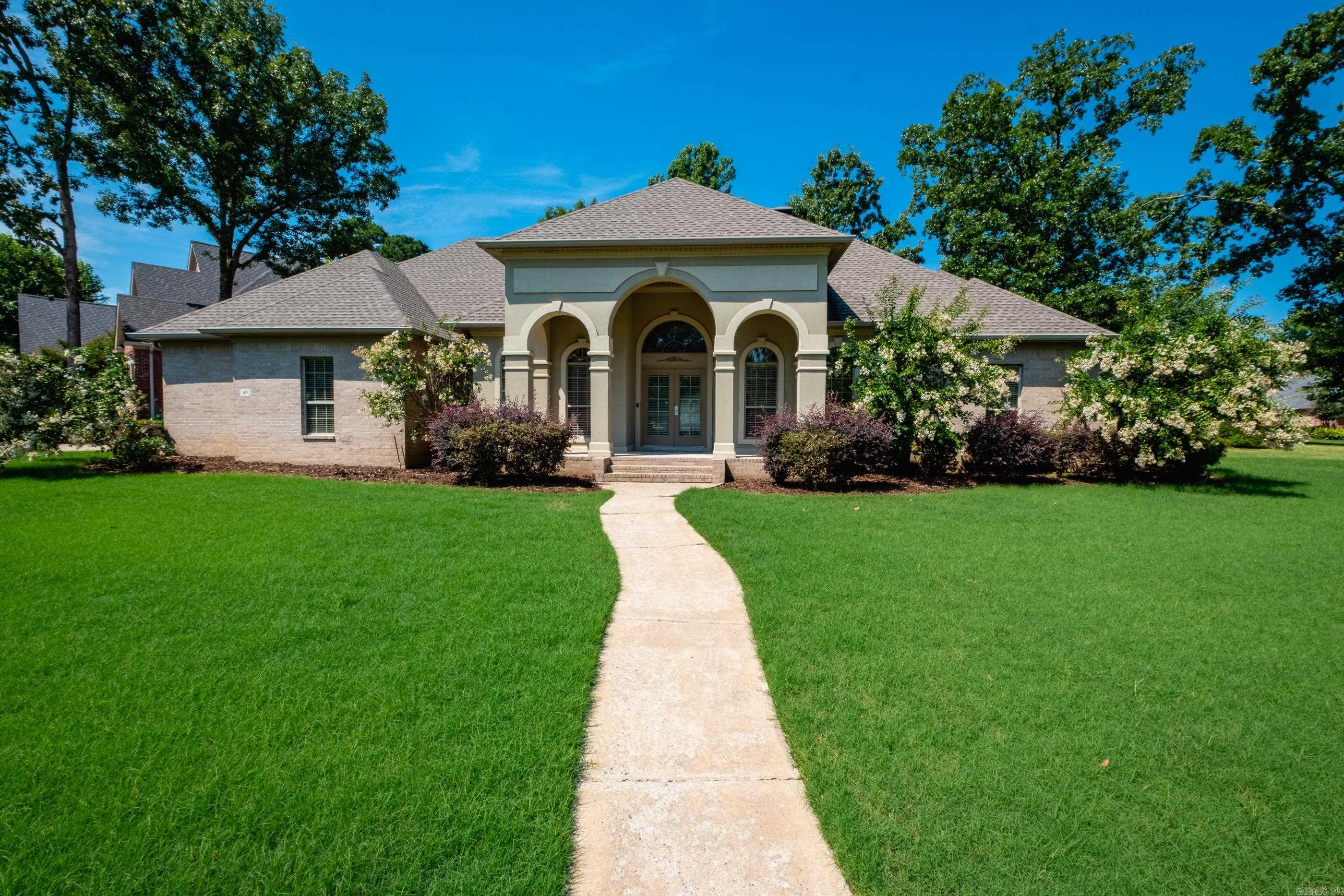 Welcome to Margeaux in Chenal Valley! This one-level home offers 4 bedrooms, 3.5 baths, a dedicated office, and a thoughtfully designed split floor plan on a level lot.  The primary suite is tucked away, creating a peaceful retreat. A separate guest suite with its own en suite bath is perfect for visitors or multigenerational living, while two additional bedrooms share a bath. Soaring ceilings and abundant natural light create an open, inviting atmosphere throughout.  Recent updates include interior paint and new flooring (zero carpet). Enjoy both covered front and back patios, with the rear patio featuring beautiful flagstone—an ideal space for relaxing or entertaining. A spacious 3-car garage, a 2021 roof, washer/dryer to convey add even more value.  As a Margeaux resident, you'll enjoy access to Chenal's outstanding amenities, including multiple pools & playgrounds. Just minutes from Pinnacle Mountain State Park, Walmart, shopping, and dining. Within 1 to 3 miles of several sought-after public and private schools, including Joe T. Robinson, Pinnacle View, Baptist Preparatory School, & Little Rock Christian Academy. Agents, please see agent remarks.