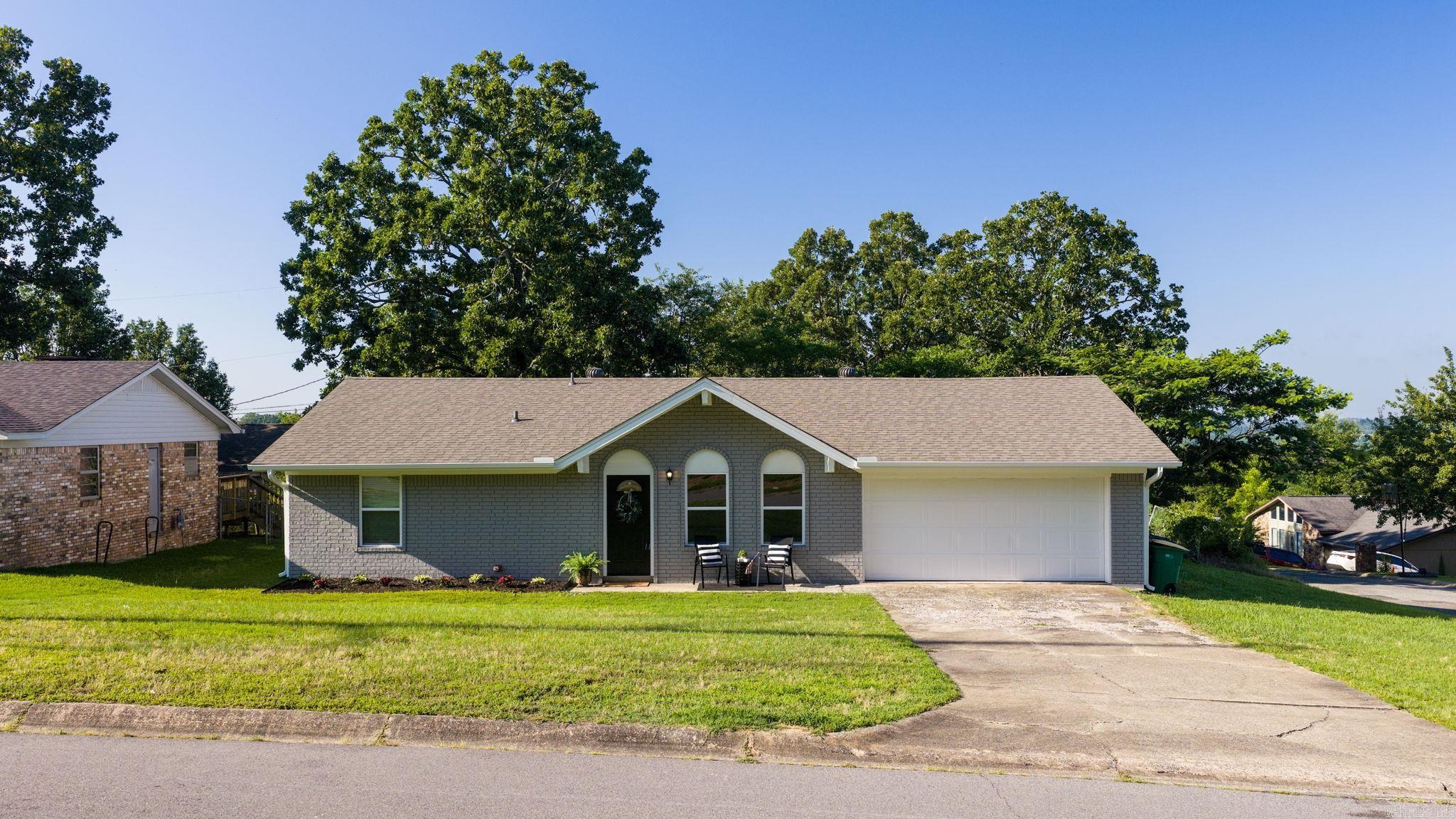 Welcome home to this adorable, well-maintained family home situated on a desirable corner lot w/fenced backyard! Lovingly owned by the same family since the 1980s, this home has been thoughtfully updated throughout the years.The kitchen & bathrooms have been renovated w/updated cabinetry, flooring & a beautiful tiled shower in the primary bath. Major improvements include removal of old attic insulation w/new insulation added,as well as updated ductwork installed in 2013.Recent 2026 updates include a new roof, new siding, fresh interior & exterior paint, new garage door & new windows.The hall bathroom features a newer tub & surround installed approximately three years ago & the water heater is also approximately three years old.Inside, you’ll find two spacious living areas,a two-car garage & newer patio doors leading to the backyard.Outside offers plenty of room to relax,entertain or play,plus a storage building for additional space. Move-in ready & full of charm—don’t miss this opportunity!