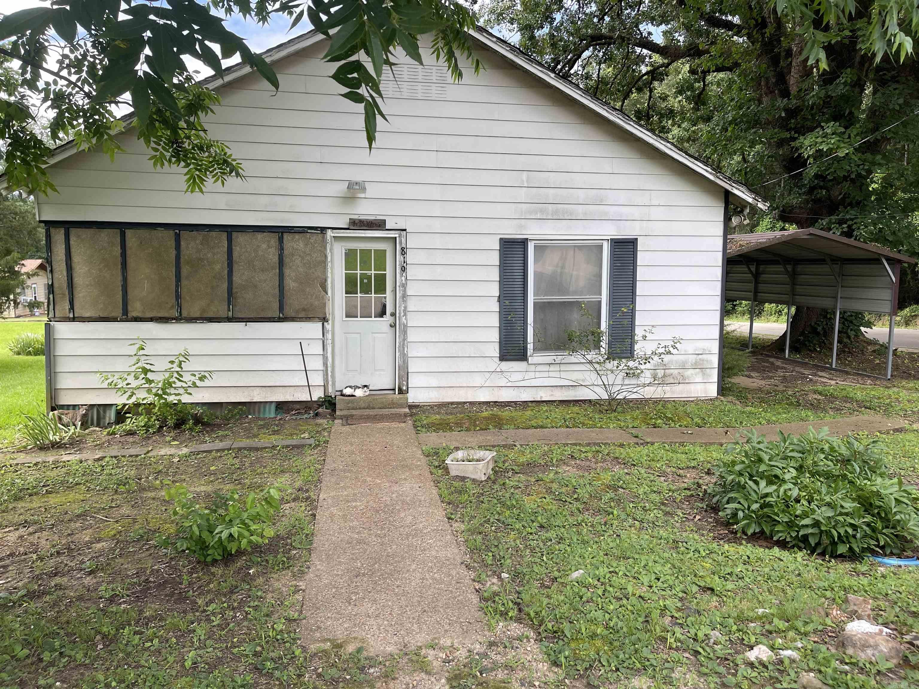 Opportunity awaits with this 4-bedroom, 1-bath home situated on a highly visible corner lot in a prime location. Built in 1940, the home has updated windows, floor repairs completed within the last 10 years, window unit air conditioning, and gas floor heaters. The property’s standout feature is the oversized corner lot, which provides ample space for a potential second residence, offering added value for investors, developers, or buyers seeking future expansion opportunities. Conveniently located near local amenities and positioned in a high-traffic area, with new concrete sidewalks from the school into downtown DeQueen.  This property offers endless possibilities for residential use, rental income, or future development. Buyer to verify all measurements, zoning, utility availability, and building requirements.