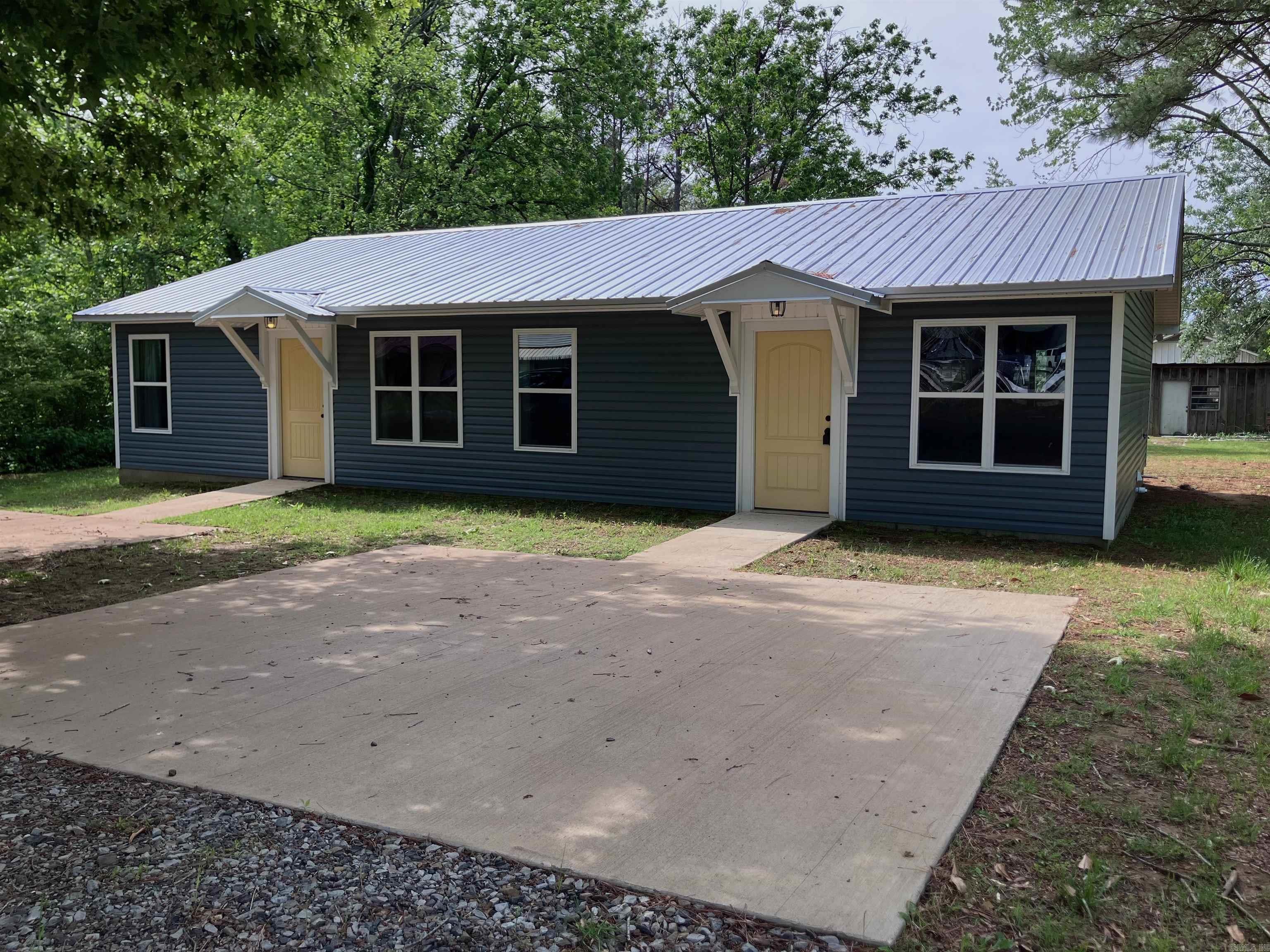 Investment opportunity! This newly constructed duplex has serious income potential. Each unit features 2 Bedrooms and 1 Bathroom, an open floor plan, and a kitchen island with an island range vent hood. Everything is brand new! There are two separate parking pads and a very large backyard. This duplex will qualify for an FHA loan if the buyer lives in one of the units.  So, you could potentially live in one unit, and let the other unit pay for your mortgage! Opportunities like these don't come very often so schedule your showing now!  Some photos are virtually staged.  Square footage is approximate so measuring is encouraged.