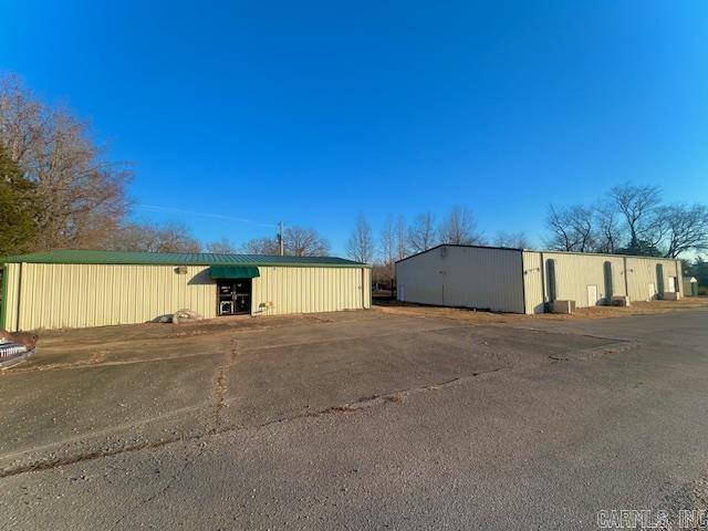 Prime investment opportunity with 3 commercial buildings totaling 12,300 sq ft. on high-visibility Highway 16 between Shirley and Fairfield Bay. Strong daily traffic to Greers Ferry Lake and the scenic Little Red River provides excellent exposure. Includes 1.92 acres, one 7,500 sq ft building, with bathrooms. There is also office space upstairs. Also 2 more buildings which are 2,400 sq ft each. One of these being mostly finished with bathroom, Office space, store frontage, or whatever you want to use it for. It could even be a nightly rental. The other 2,400 sq ft building is now a workshop. It has utilities and bathroom. This set up was formerly a well known Candle factory. Ideal for retail, restaurant, brewery, office, warehouse, rental income, or multi-tenant. So many possibilities. High traffic. Great Visibility. Endless potential in growing area. Don't miss this opportunity! Get your appointment to see it for yourself.